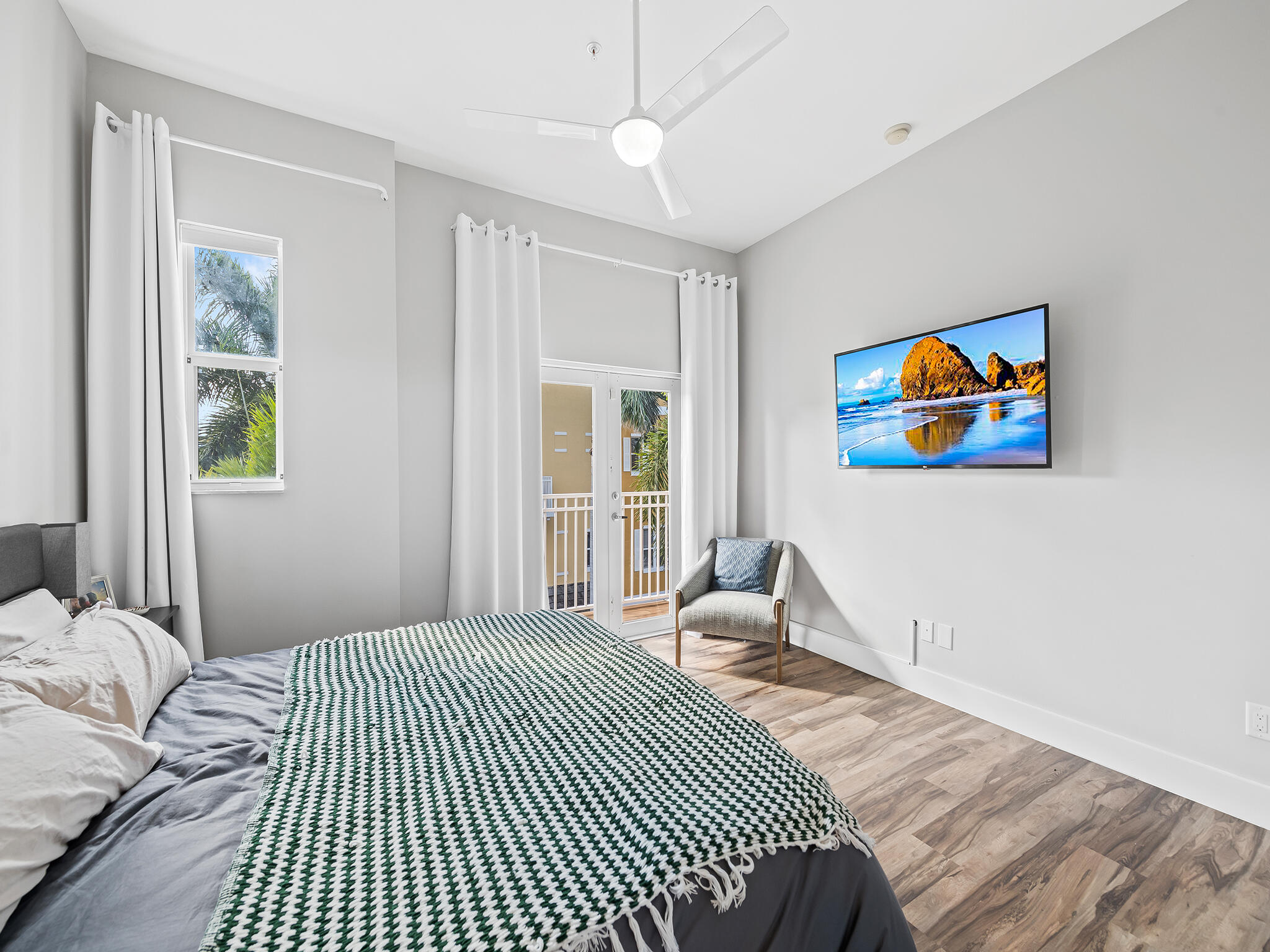 2331 Vintage Drive Lighthouse Point, FL 33064 - Photo 15 of 22 a bedroom with a bed and a painting on the wall