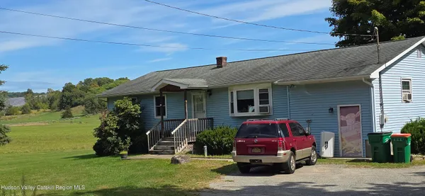 a front view of house with outdoor space