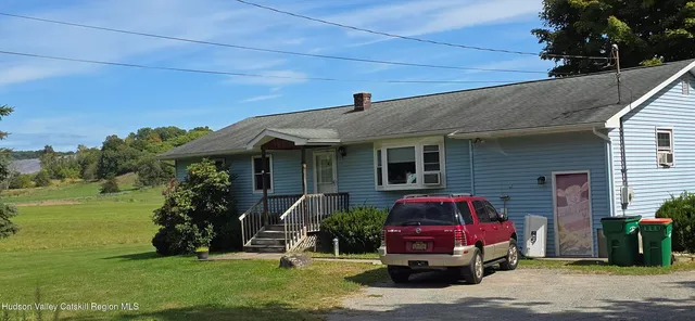 a front view of house with outdoor space