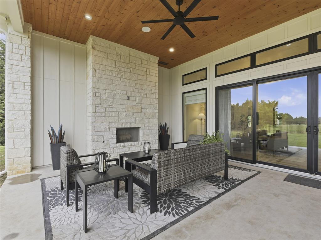 4211 Azalea Way Midlothian, TX 76065 - Photo 37 of 39 Covered patio featuring a stone-clad fireplace and wood-finish ceiling with recessed lighting