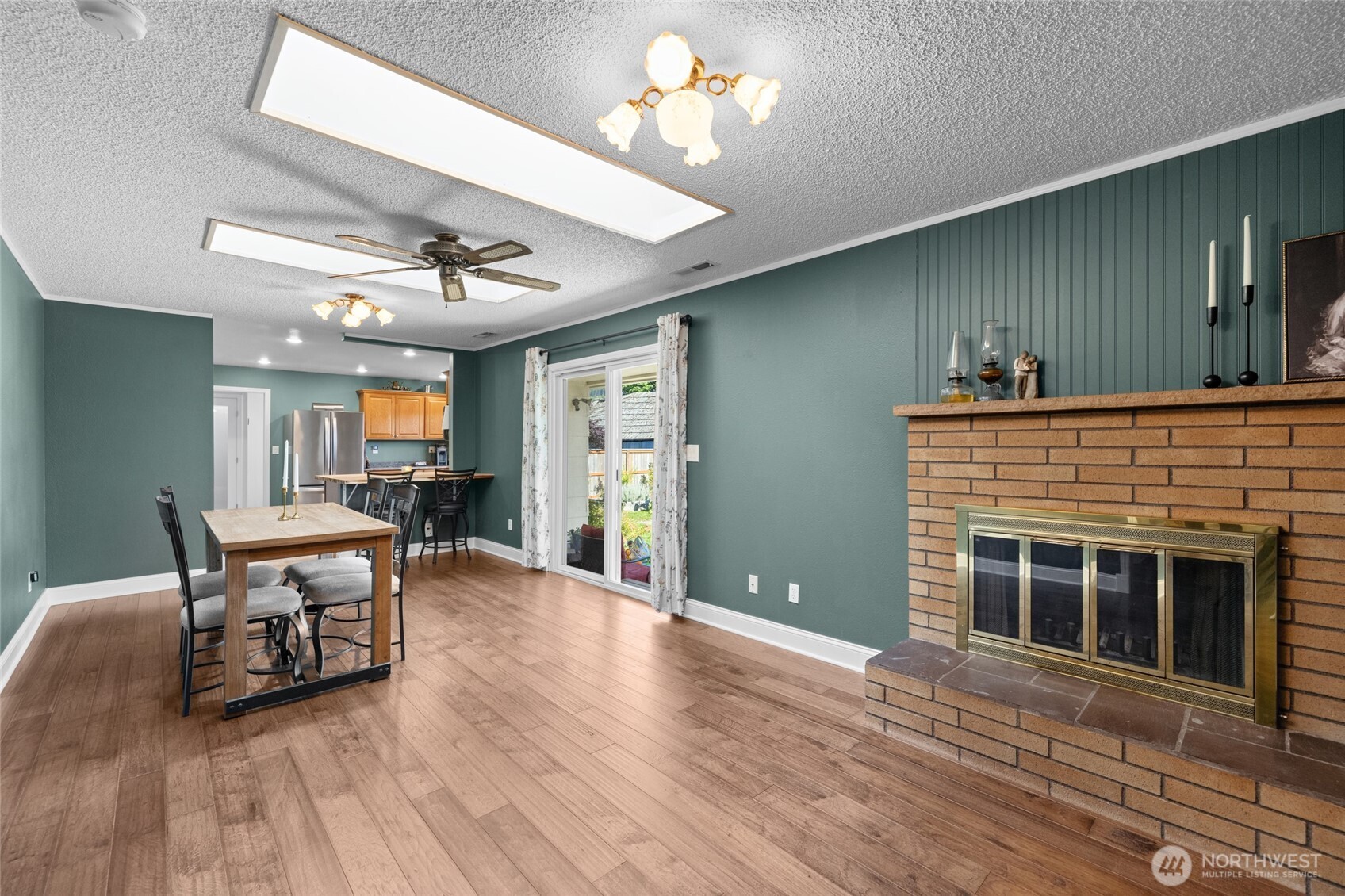 415 Sterling Street Sedro-Woolley, WA 98284 - Photo 13 of 38 a view of a livingroom with furniture wooden floor and a fireplace