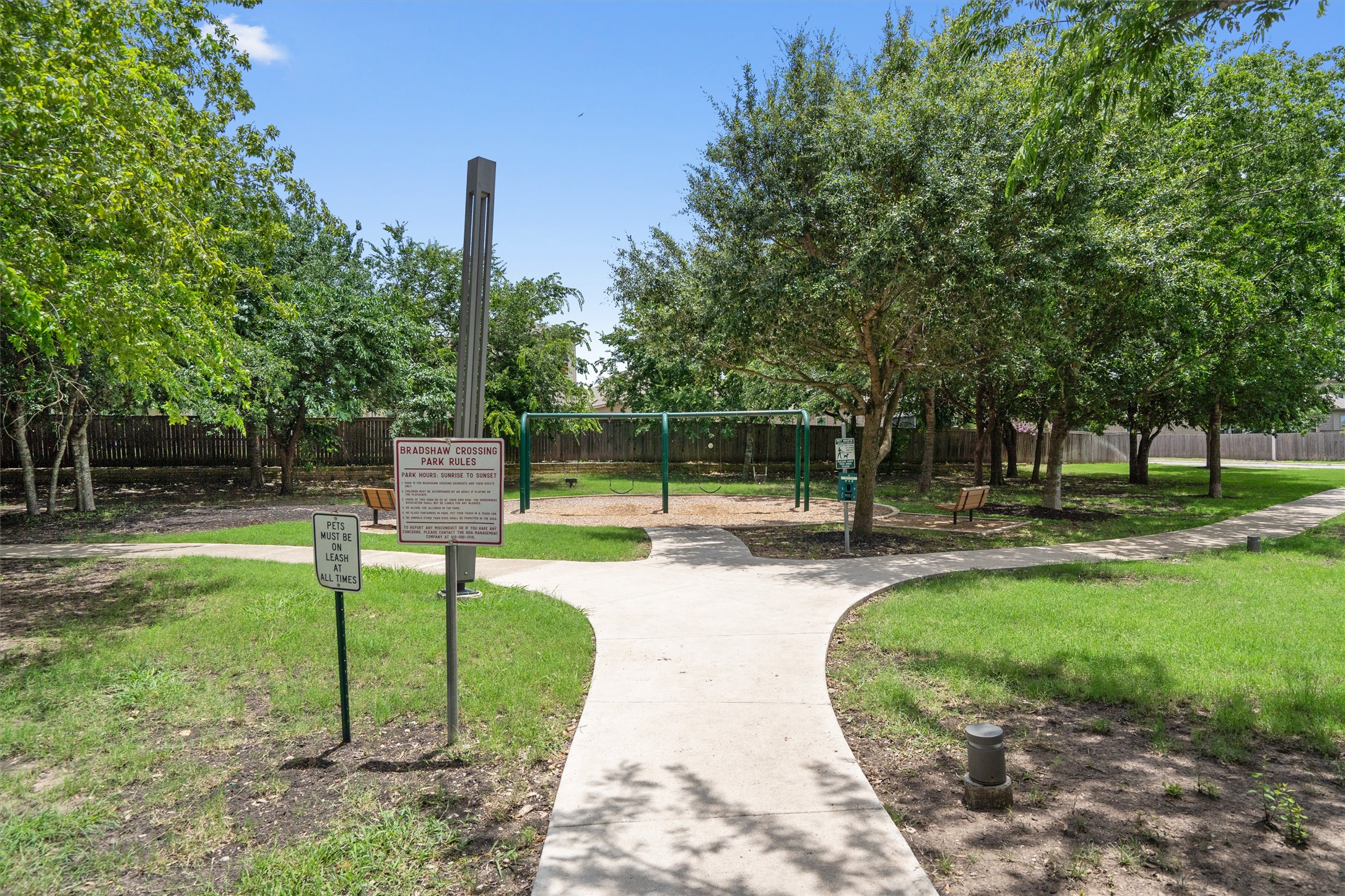 5825 Silver Screen Drive Austin, TX 78747 - Photo 35 of 40 A community park with swings, walking paths, and mature shade trees offers outdoor recreation.