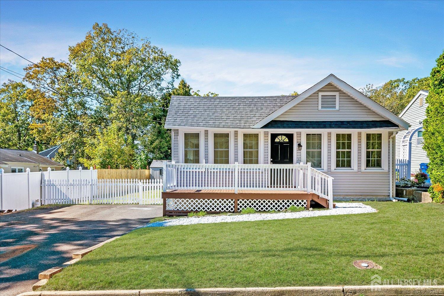 341 Victor Place Neptune, NJ 07753 - Photo 1 of 45 a front view of a house with a yard