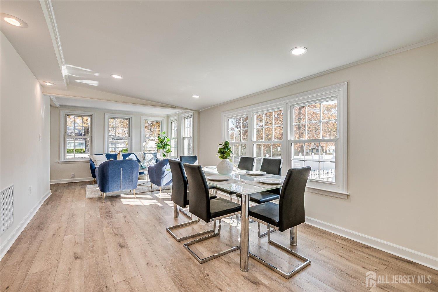 341 Victor Place Neptune, NJ 07753 - Photo 14 of 45 a living room with furniture a wooden floor and a window