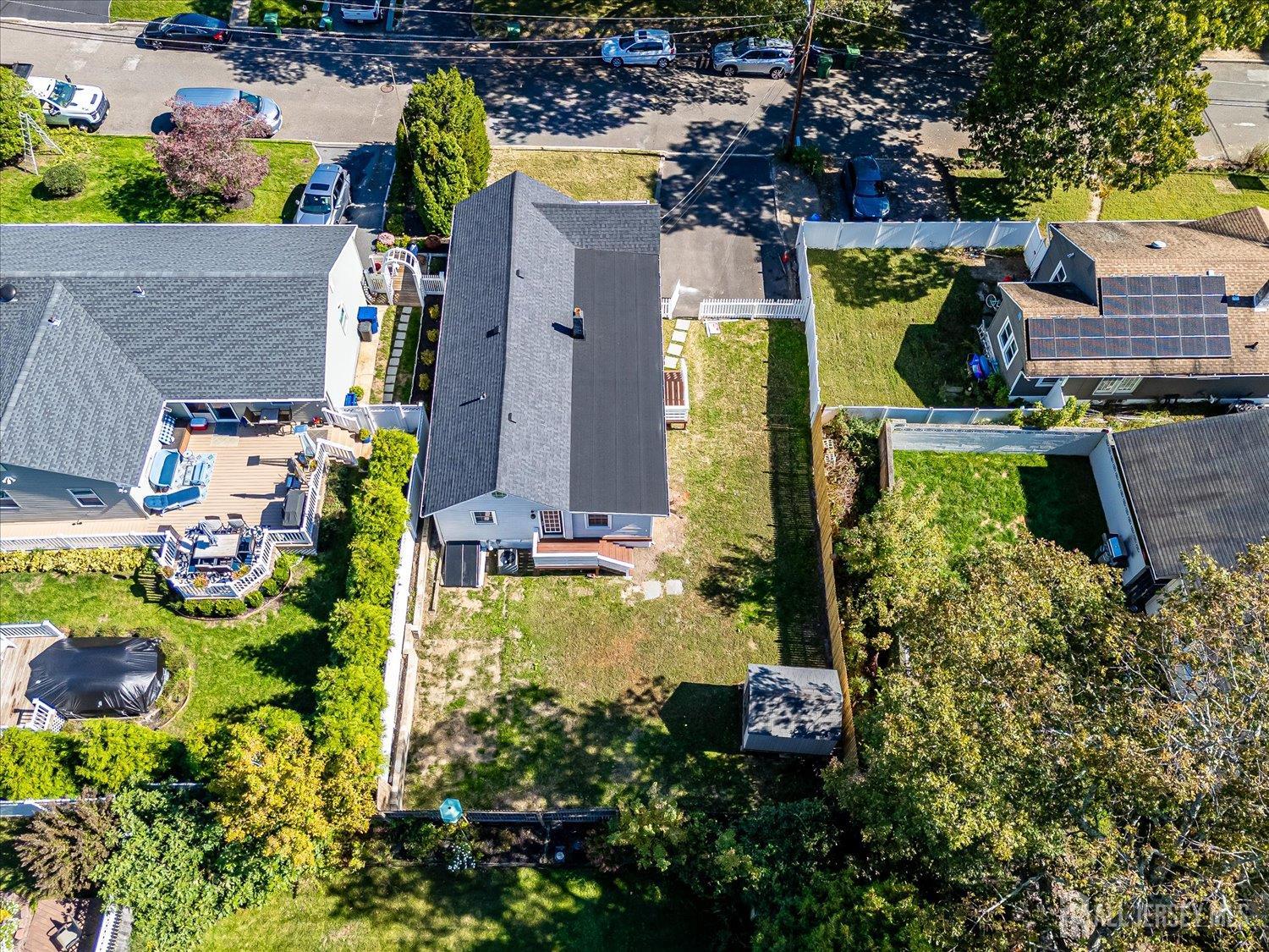 341 Victor Place Neptune, NJ 07753 - Photo 30 of 45 an aerial view of a house with a yard and lake view