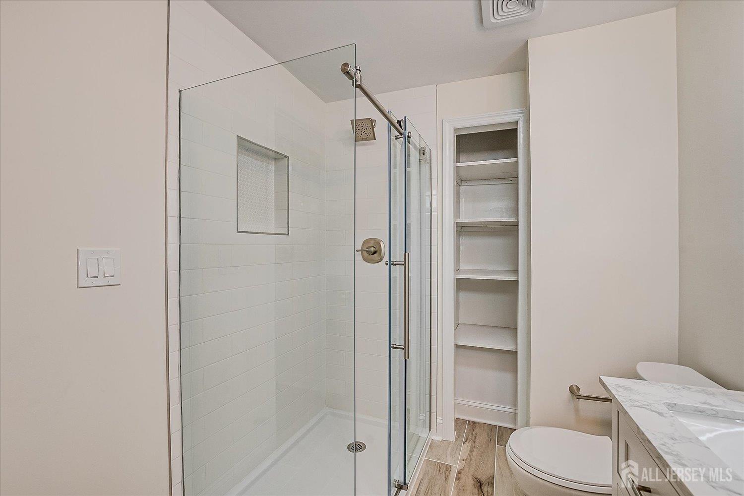 341 Victor Place Neptune, NJ 07753 - Photo 41 of 45 a white toilet sitting next to a bathroom sink