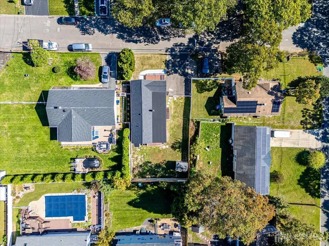 a living room with furniture a wooden floor and a window