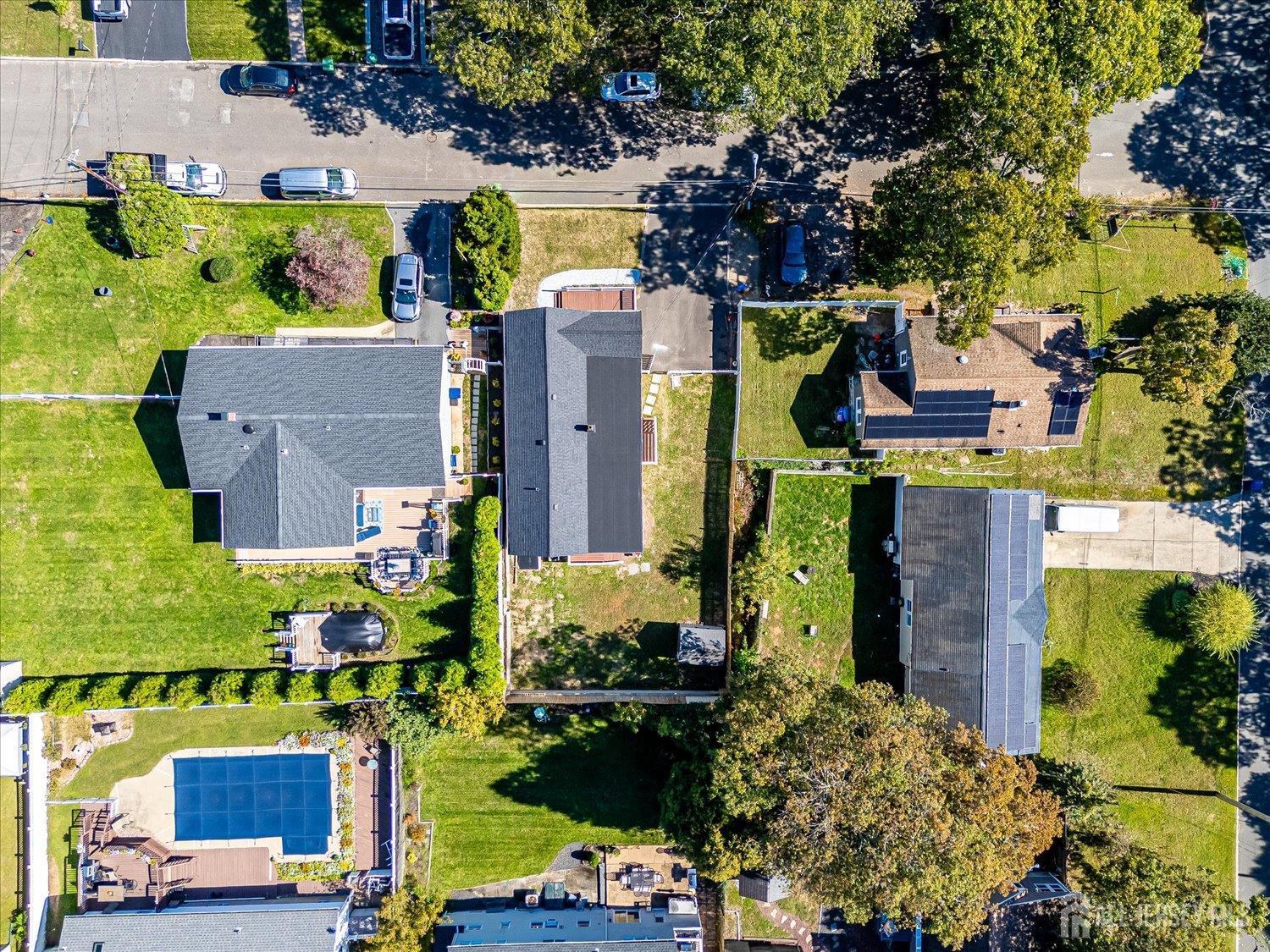 341 Victor Place Neptune, NJ 07753 - Photo 6 of 45 an aerial view of a house with a yard and swimming pool