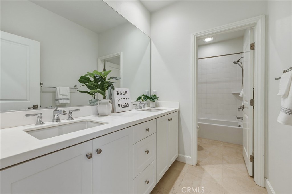 108 Henderson Irvine, CA 92620 - Photo 27 of 37 a bathroom with a double vanity sink and mirror