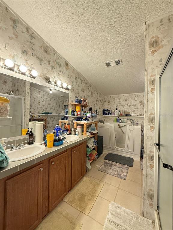 5109 Southwest 10th Street Bell, FL 32619 - Photo 35 of 38 a kitchen with sink cabinets and window