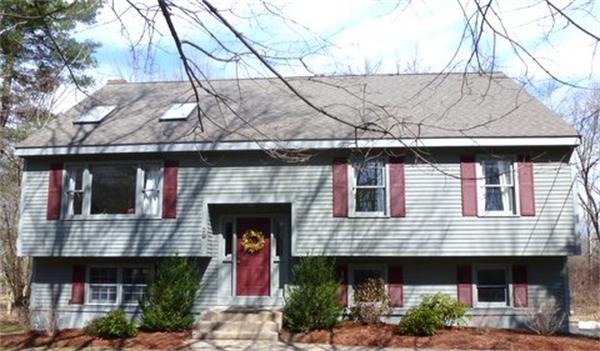 29 Concord Road Bedford, MA 01730 - Photo 1 of 24 a front view of a house with garden