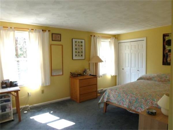29 Concord Road Bedford, MA 01730 - Photo 13 of 24 a bedroom with a bed and a window