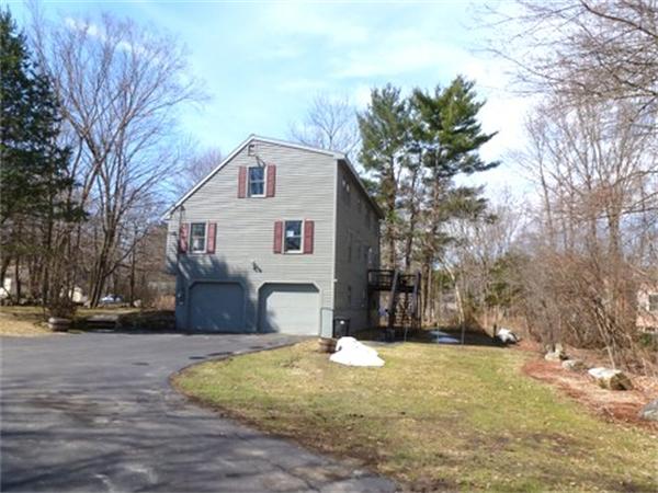 29 Concord Road Bedford, MA 01730 - Photo 2 of 24 a view of a white house next to a road and trees