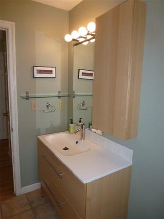 29 Concord Road Bedford, MA 01730 - Photo 23 of 24 a bathroom with a sink and a mirror
