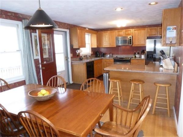 29 Concord Road Bedford, MA 01730 - Photo 8 of 24 a view of a dining room with furniture window and wooden floor