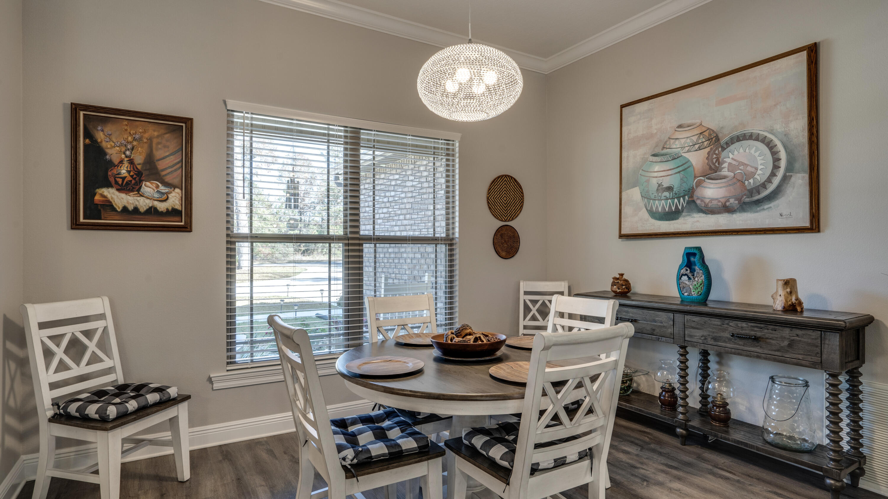 7066 Senterfitt Road Laurel Hill, FL 32567 - Photo 15 of 59 a view of a dining room with furniture window and wooden floor