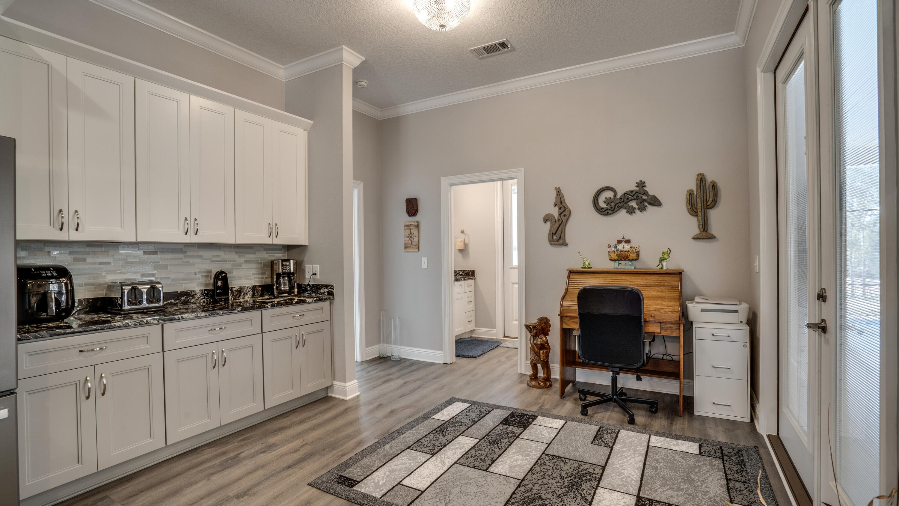 7066 Senterfitt Road Laurel Hill, FL 32567 - Photo 16 of 59 a kitchen with stainless steel appliances a stove a sink and a refrigerator