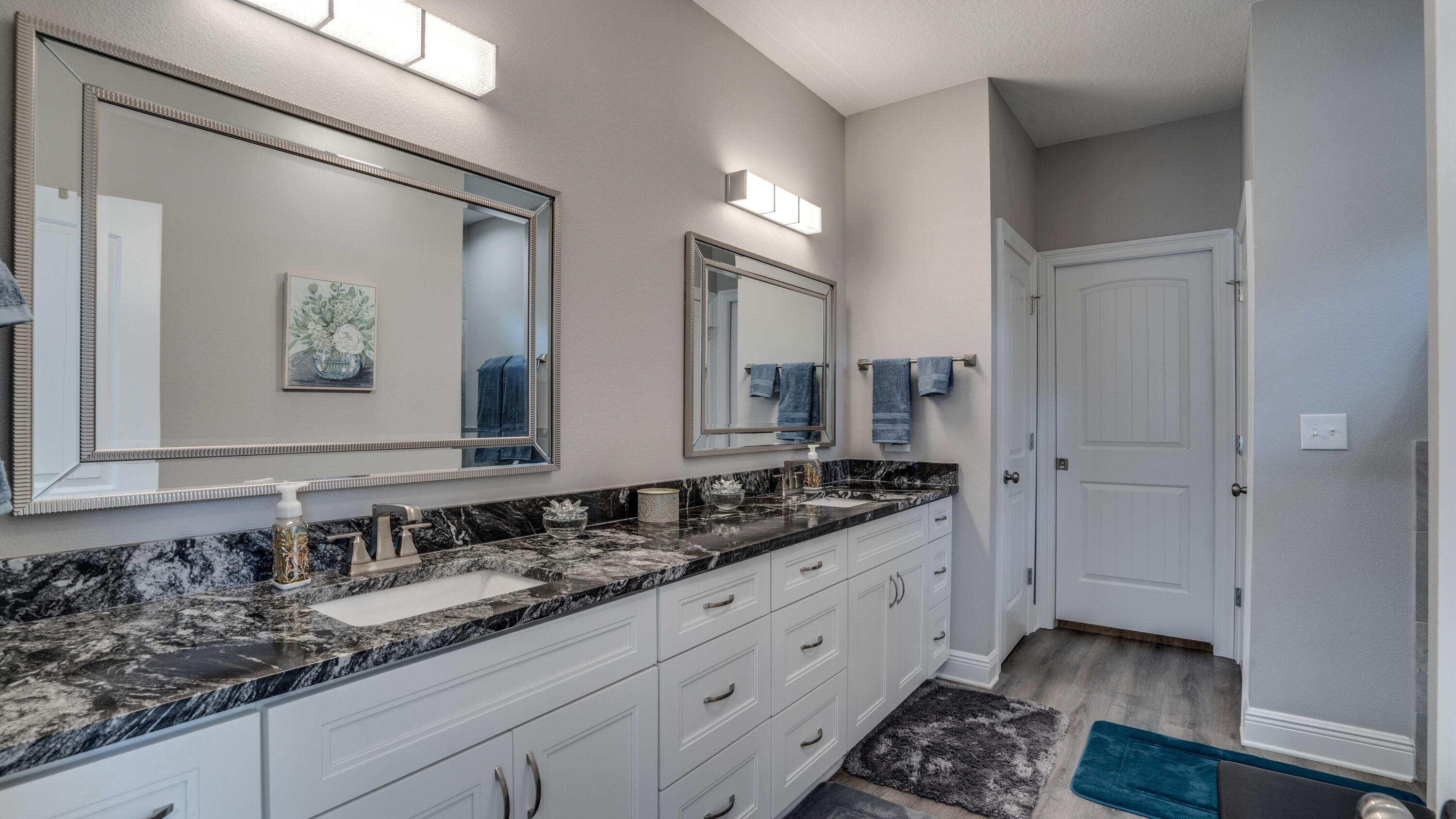 7066 Senterfitt Road Laurel Hill, FL 32567 - Photo 20 of 59 a bathroom with a double vanity sink and a mirror