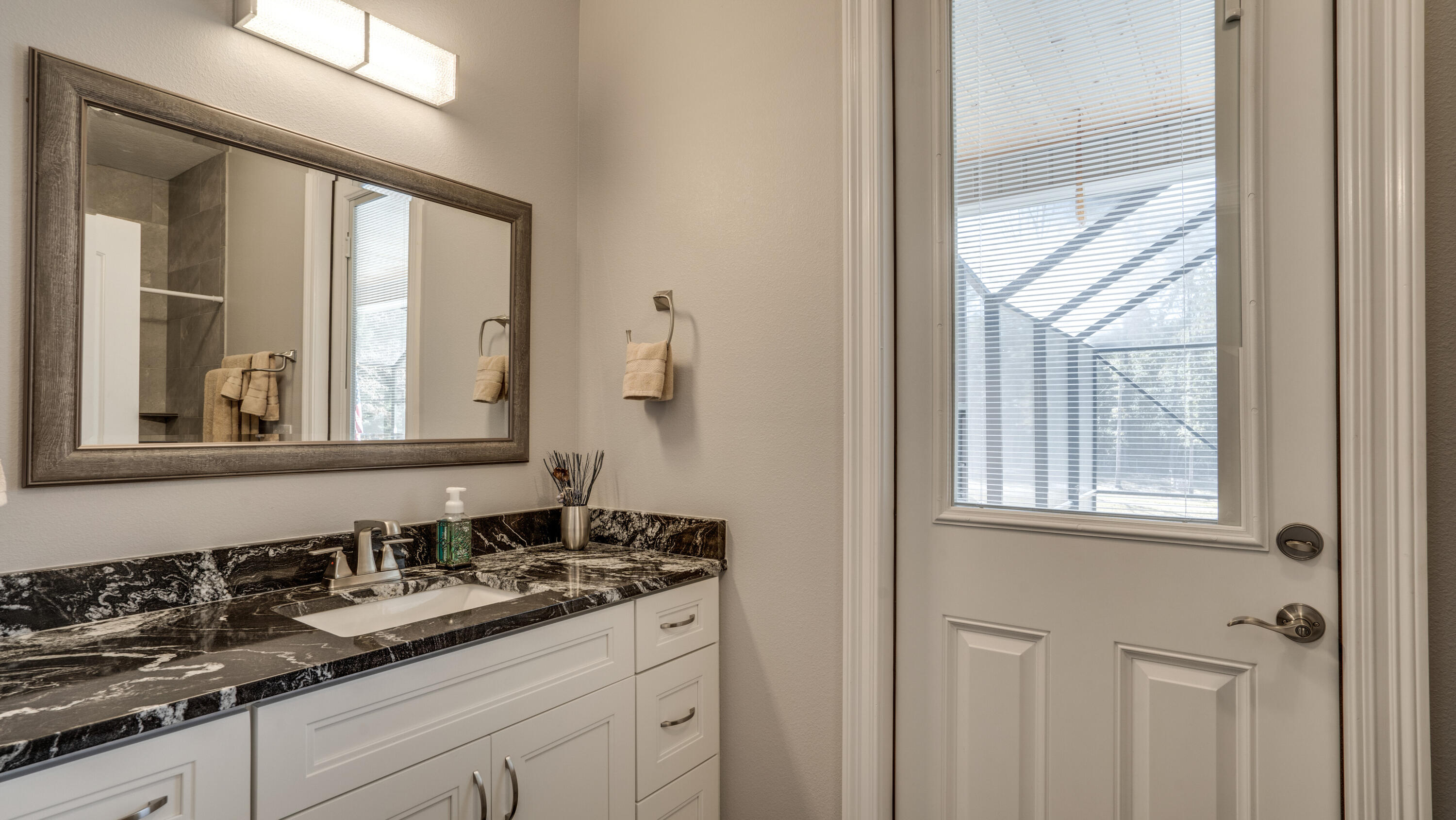 7066 Senterfitt Road Laurel Hill, FL 32567 - Photo 22 of 59 a bathroom with a sink and a mirror