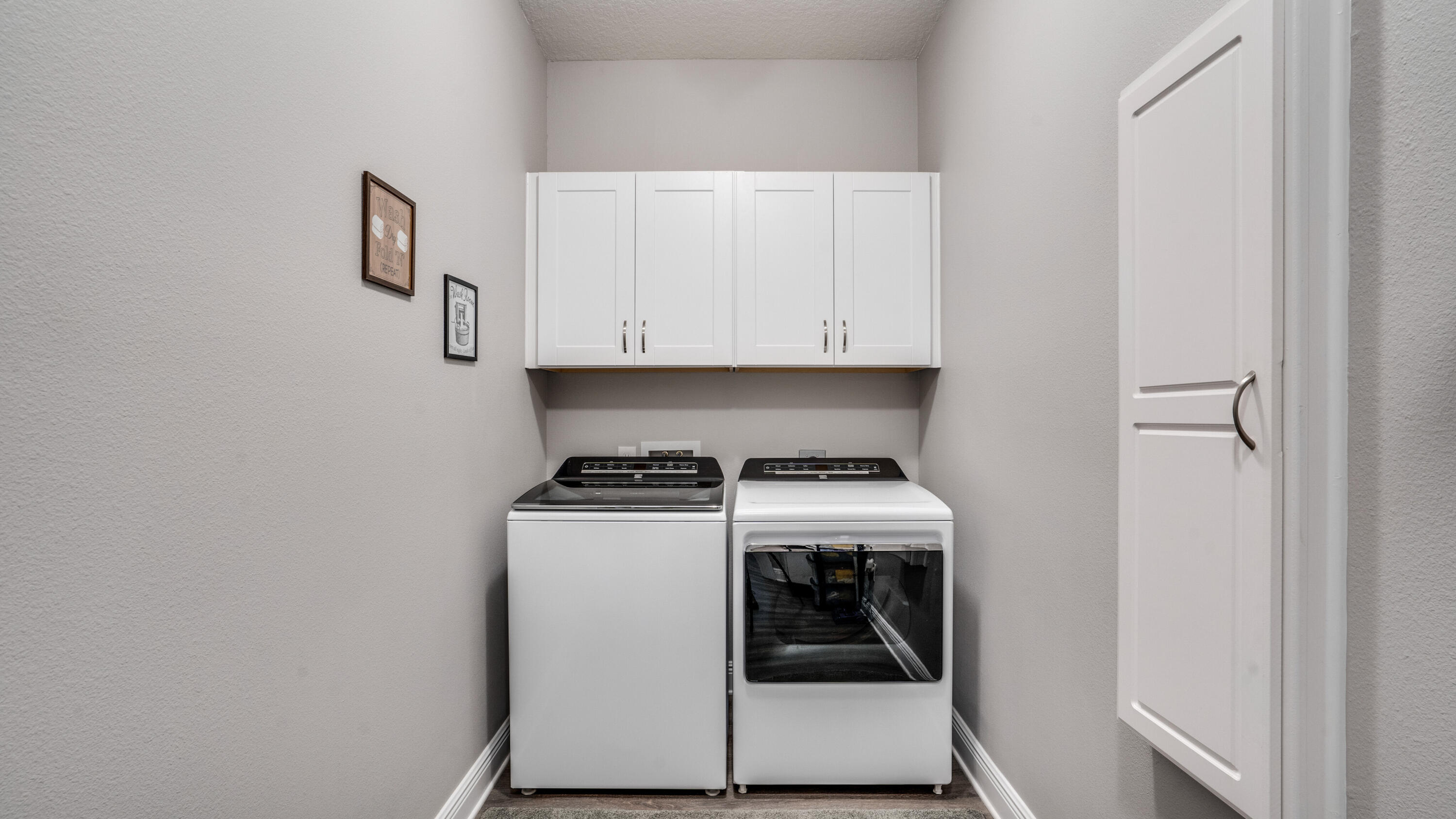 7066 Senterfitt Road Laurel Hill, FL 32567 - Photo 27 of 59 a utility room with dryer and washer