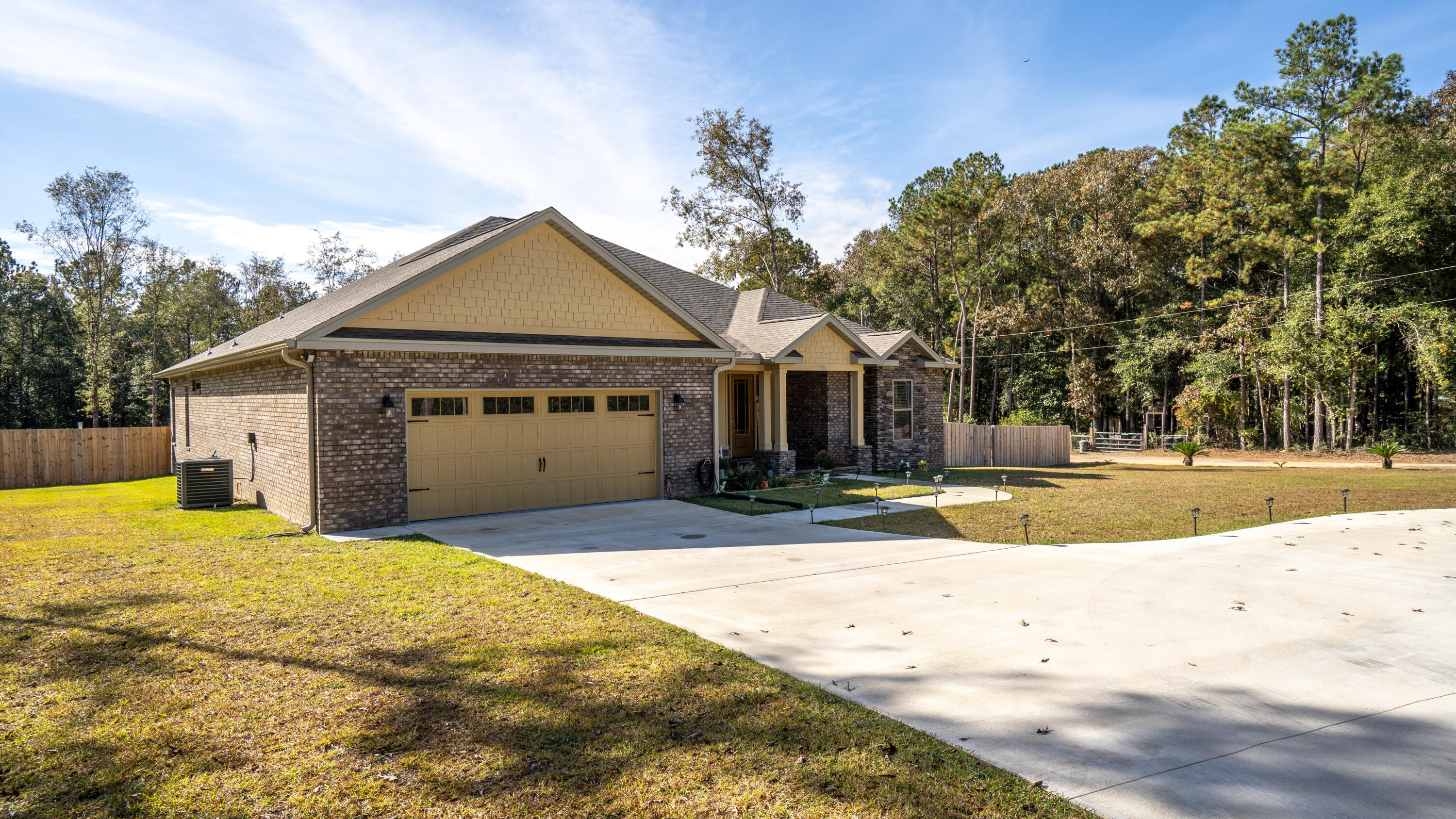 7066 Senterfitt Road Laurel Hill, FL 32567 - Photo 3 of 59 a view of a house with a swimming pool