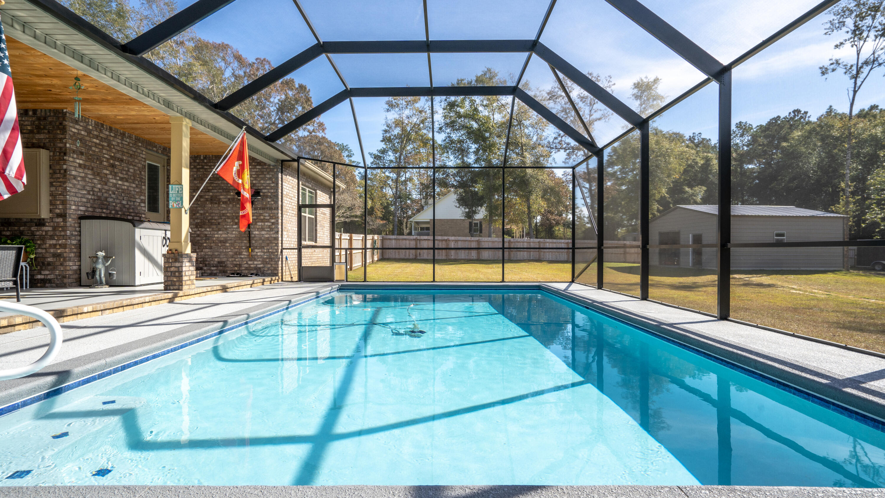 7066 Senterfitt Road Laurel Hill, FL 32567 - Photo 35 of 59 a swimming pool with a outdoor seating