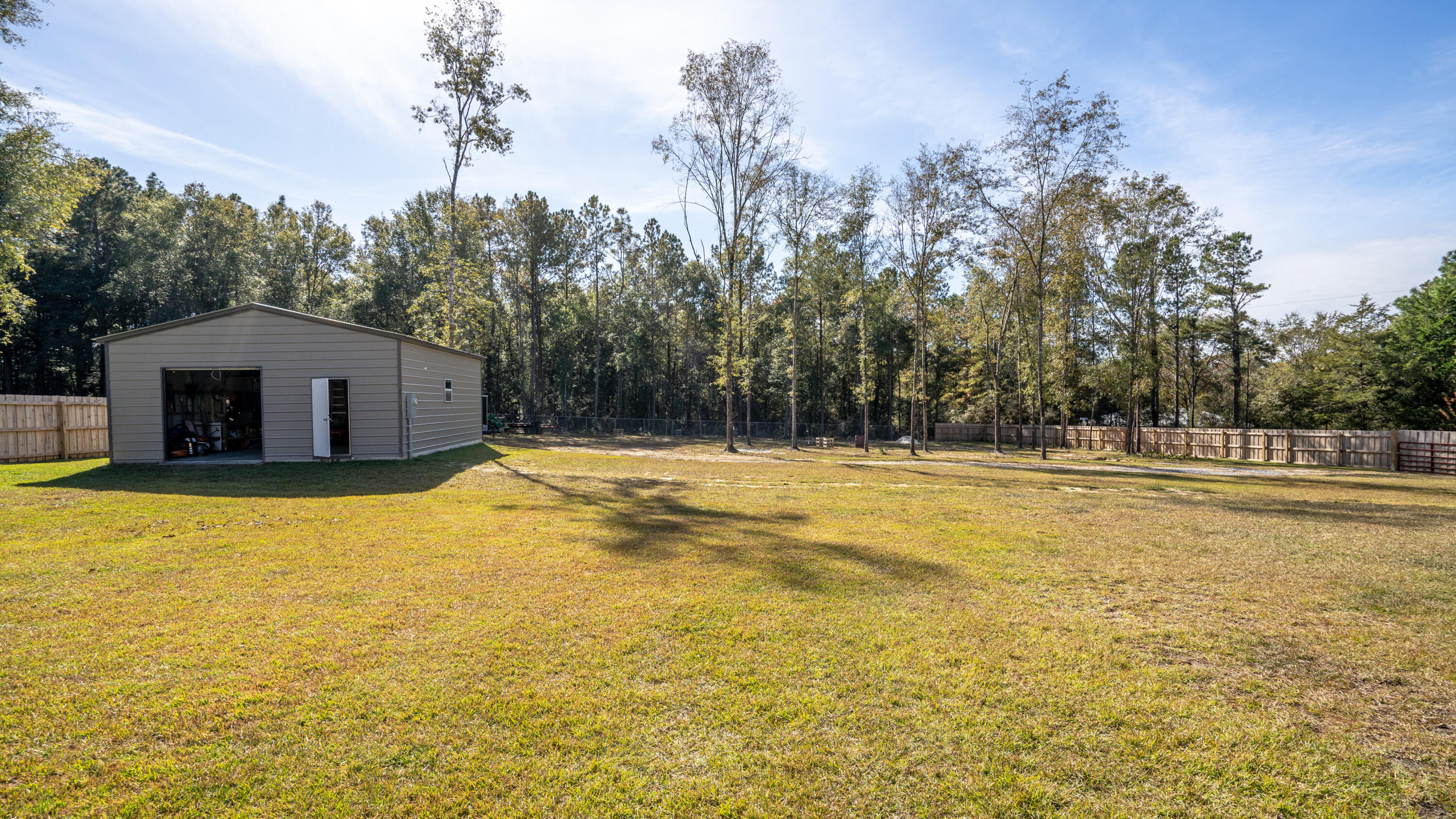 7066 Senterfitt Road Laurel Hill, FL 32567 - Photo 37 of 59 a house view with swimming pool in front of the house