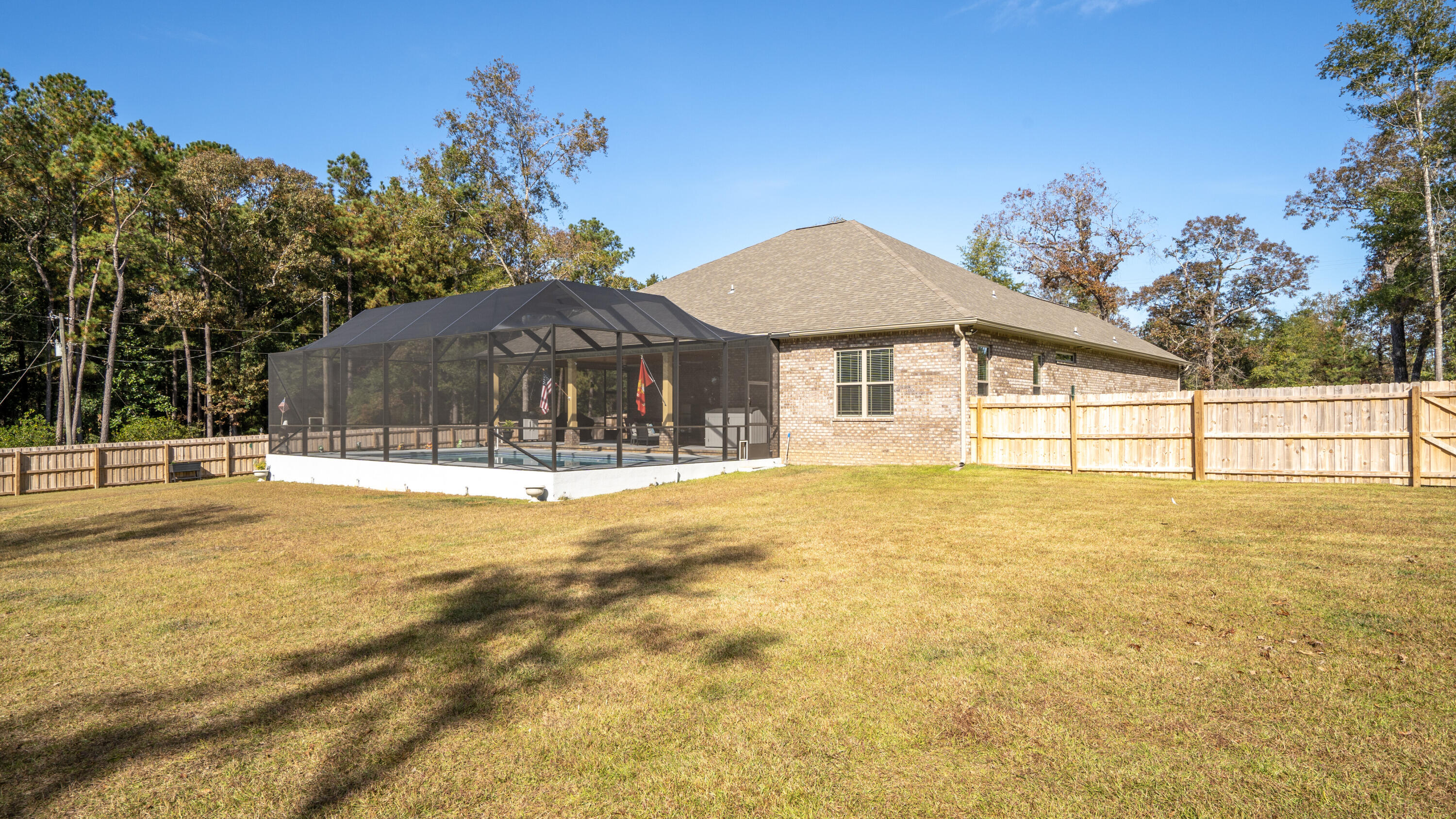 7066 Senterfitt Road Laurel Hill, FL 32567 - Photo 38 of 59 a house view with swimming pool and deck