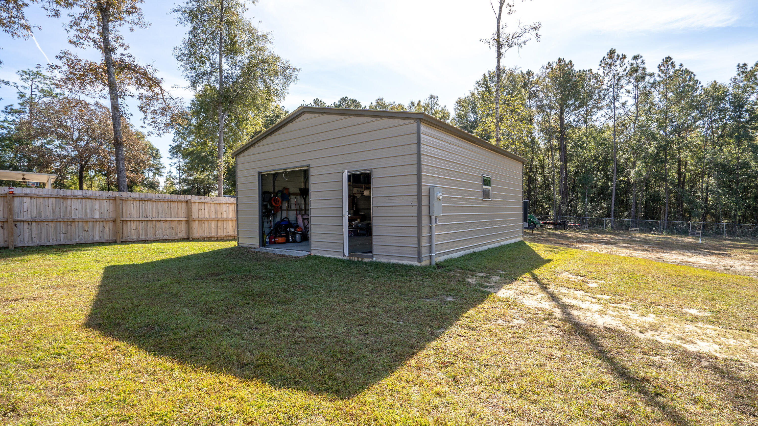 7066 Senterfitt Road Laurel Hill, FL 32567 - Photo 43 of 59 a view of a backyard with a garden
