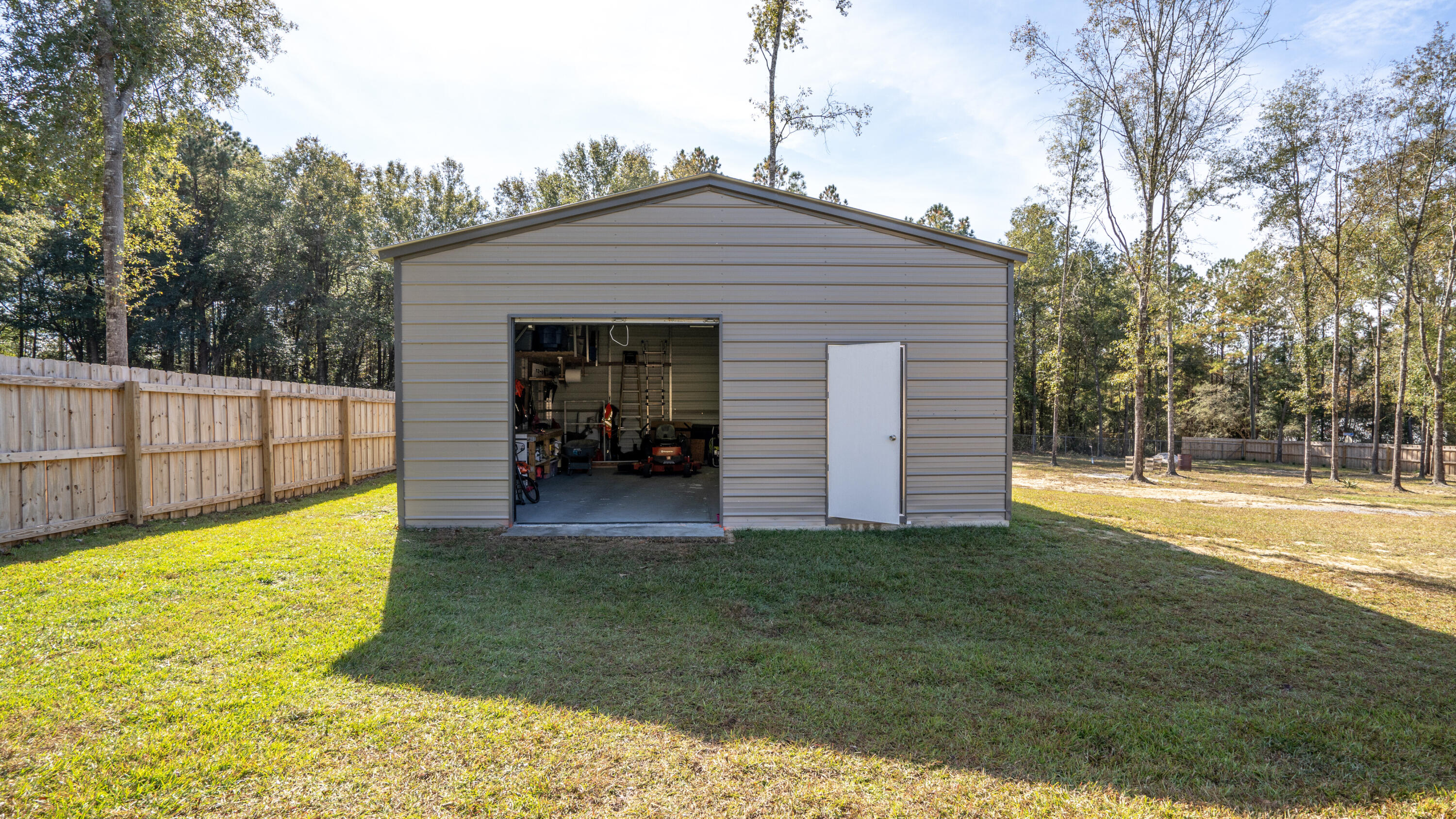 7066 Senterfitt Road Laurel Hill, FL 32567 - Photo 44 of 59 a view of a backyard with small cabin