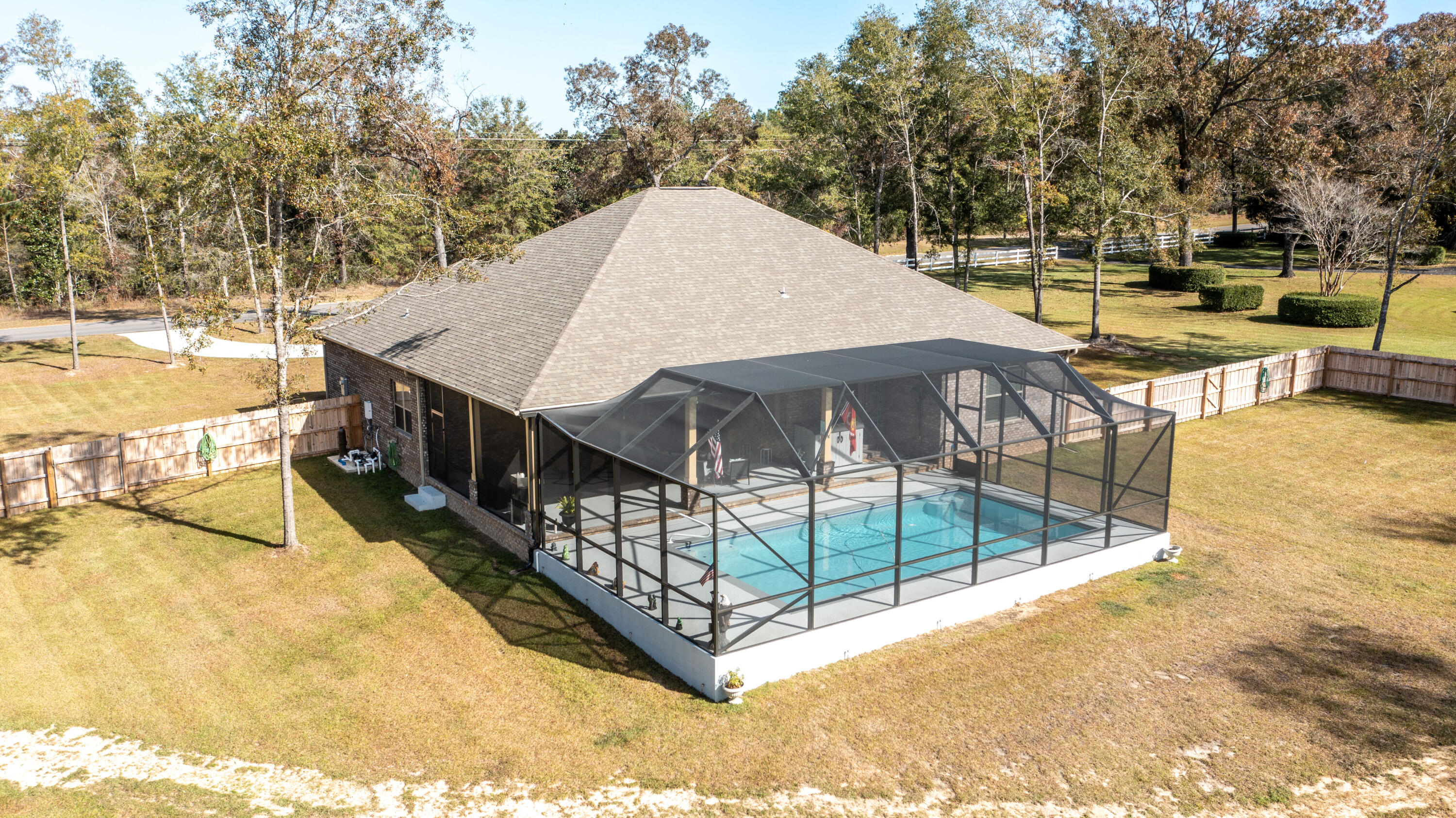 7066 Senterfitt Road Laurel Hill, FL 32567 - Photo 46 of 59 a view of a swimming pool with a patio