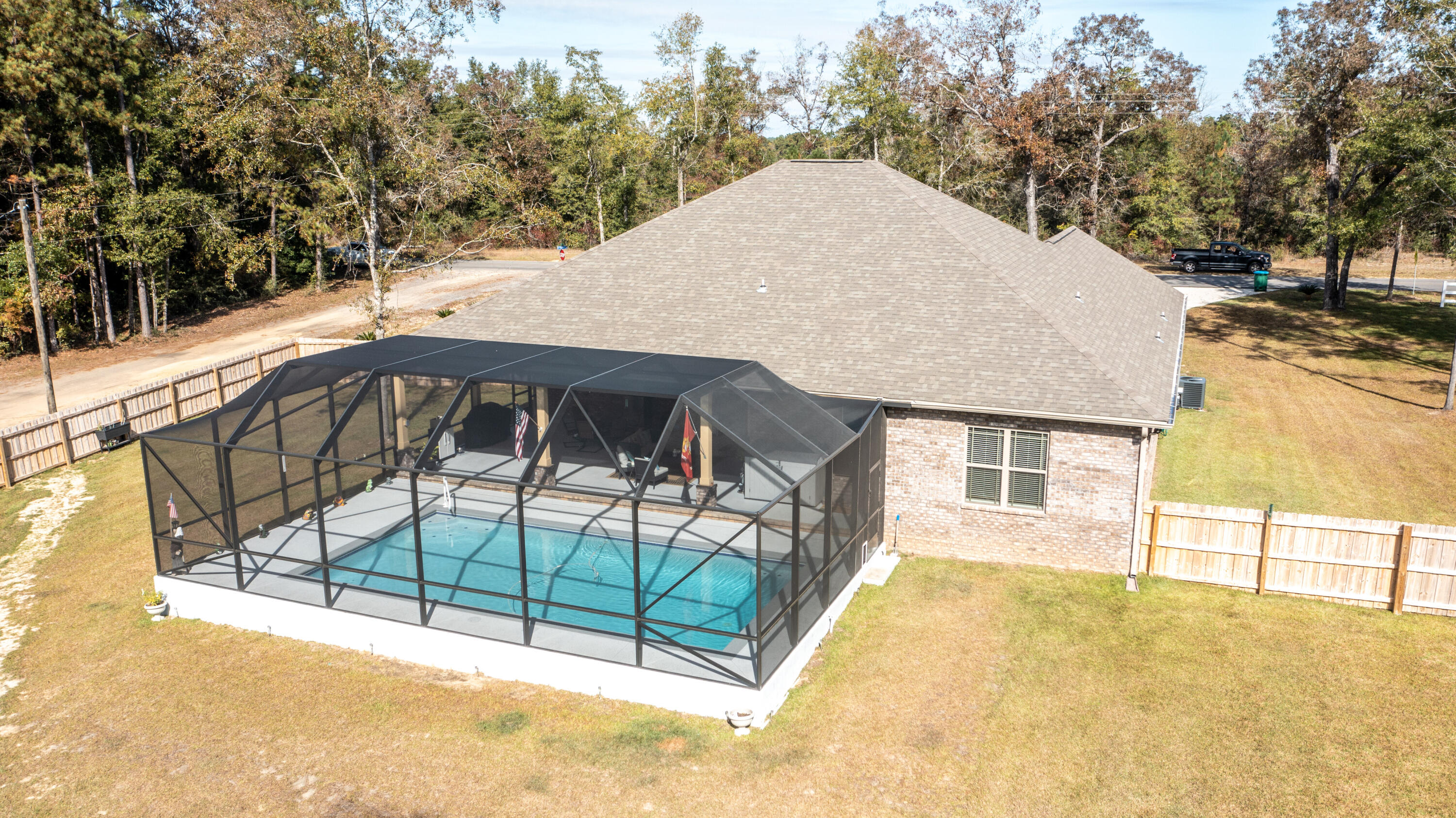 7066 Senterfitt Road Laurel Hill, FL 32567 - Photo 48 of 59 a view of backyard with a patio and wooden fence