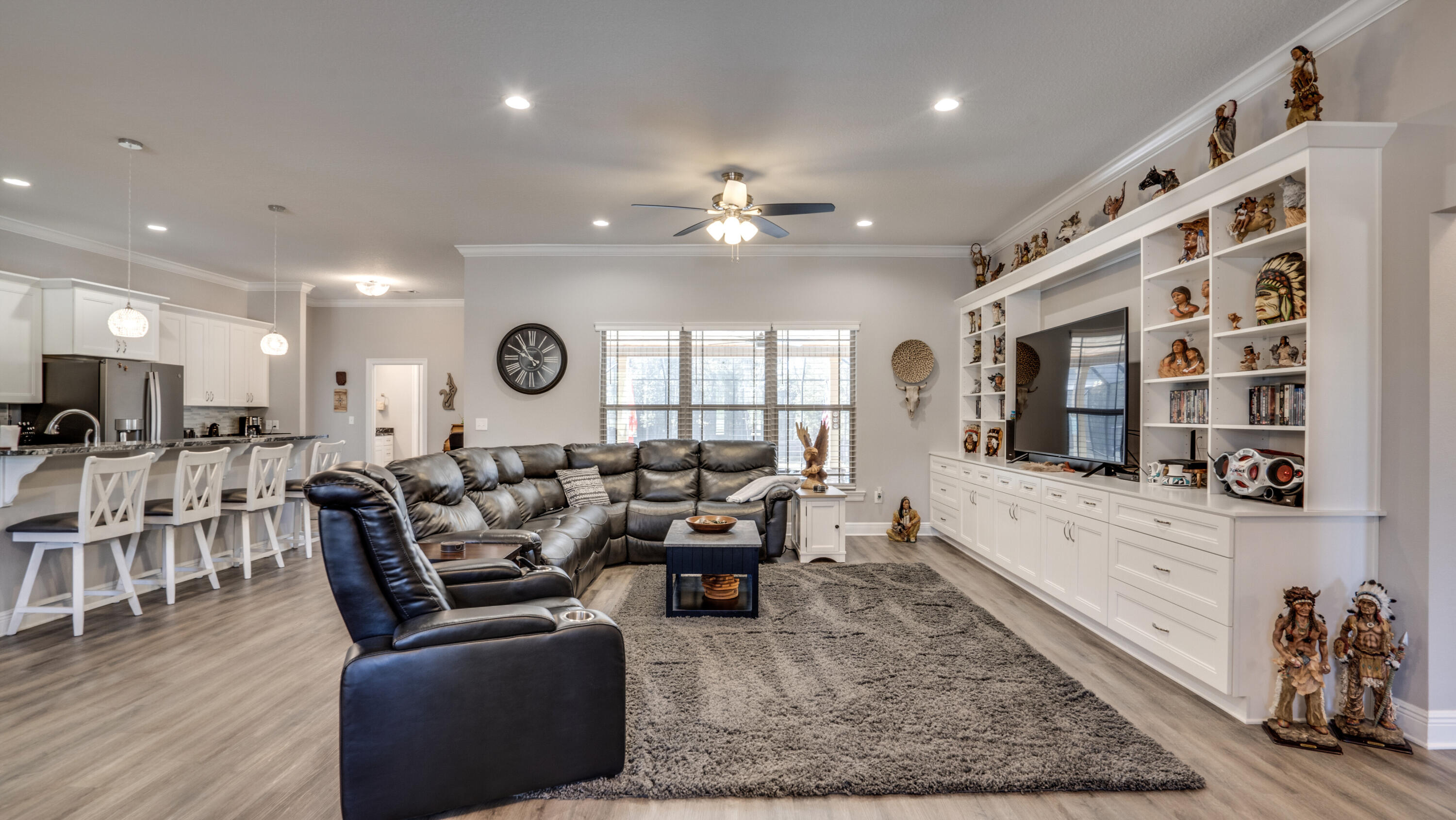 7066 Senterfitt Road Laurel Hill, FL 32567 - Photo 5 of 59 a living room with furniture a wooden floor and chandelier