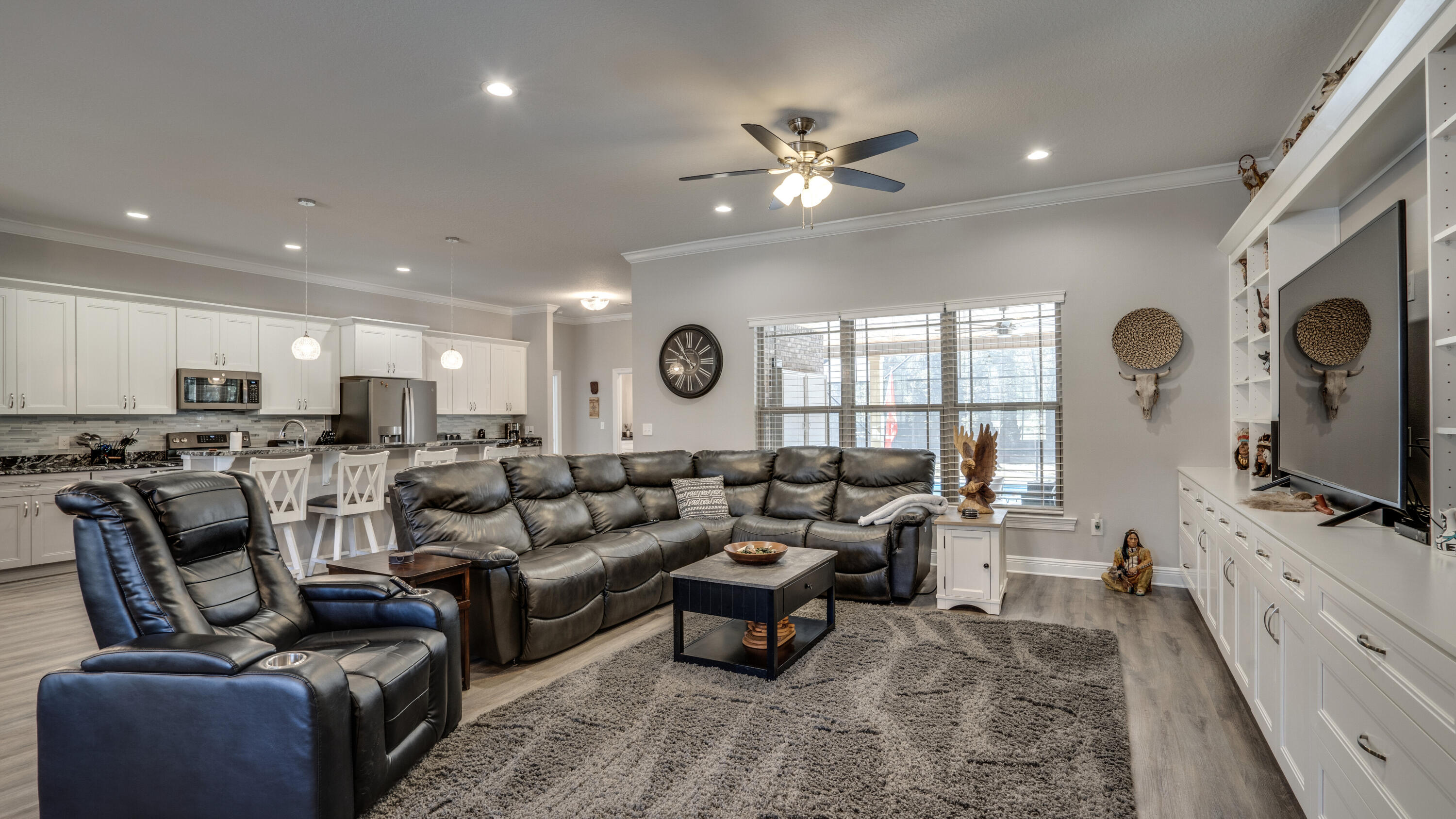 7066 Senterfitt Road Laurel Hill, FL 32567 - Photo 6 of 59 a living room with furniture and a flat screen tv