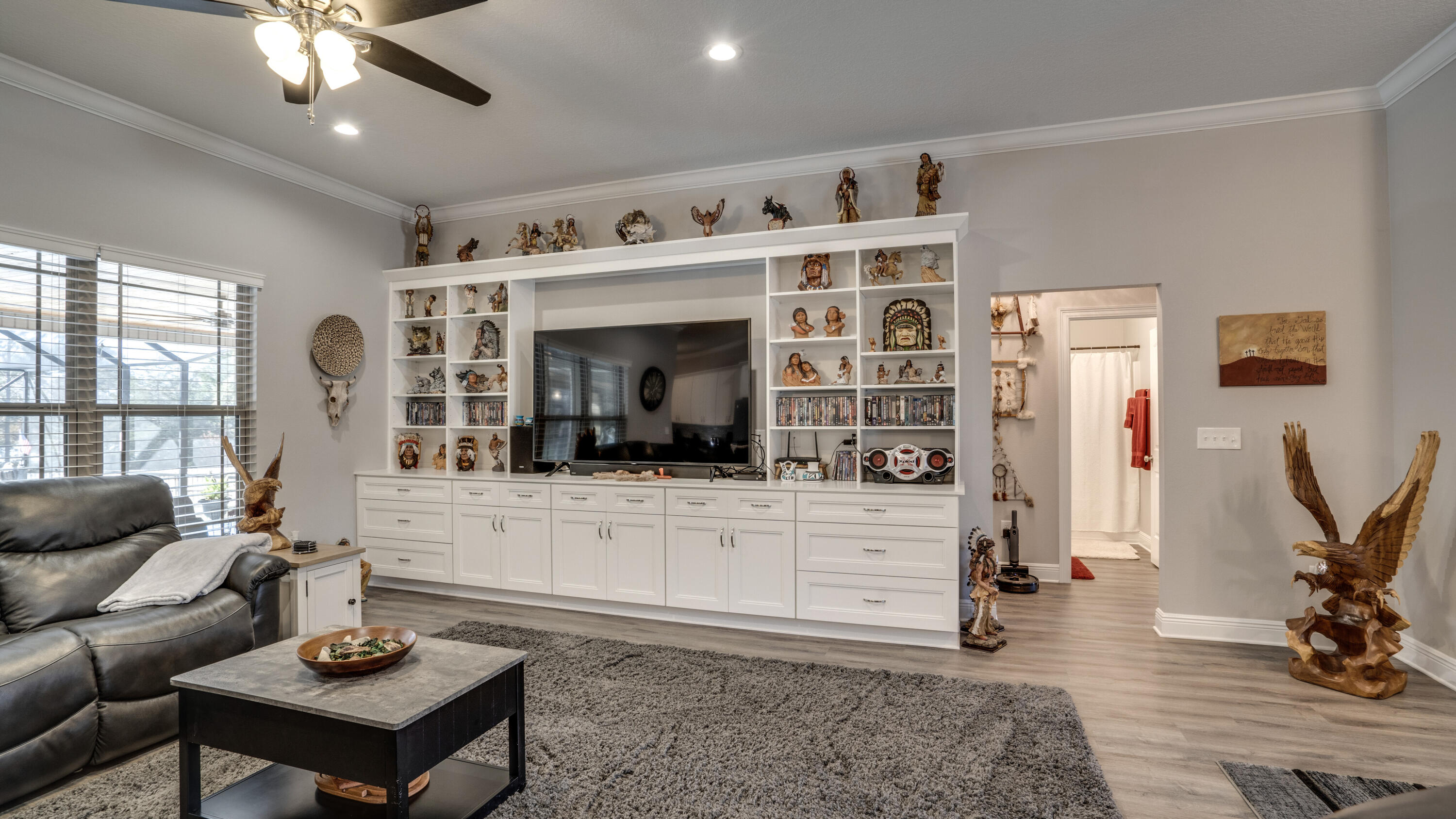 7066 Senterfitt Road Laurel Hill, FL 32567 - Photo 7 of 59 a living room with furniture and a flat screen tv