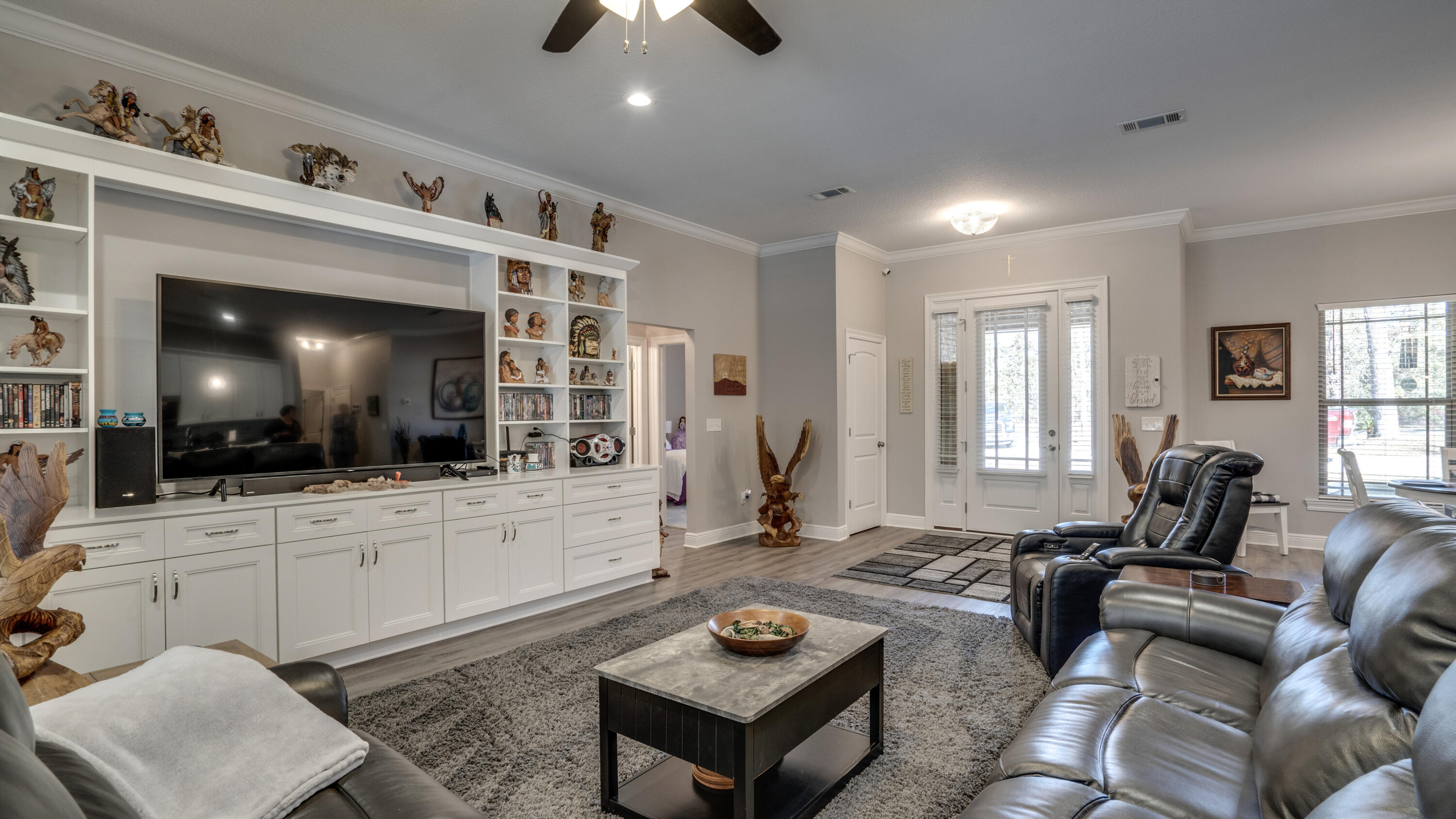 7066 Senterfitt Road Laurel Hill, FL 32567 - Photo 8 of 59 a living room with furniture and a flat screen tv