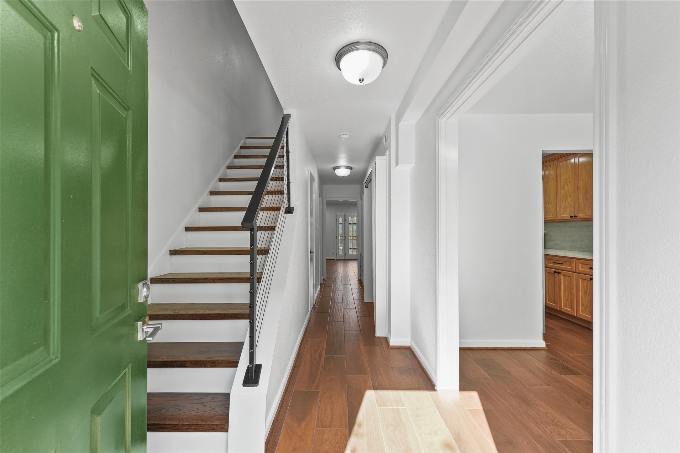 11550 Chimney Rock Road, Unit 536 Houston, TX 77035 - Photo 4 of 28 Wooden stairway leading to the 2nd floor with formal dining to the right
