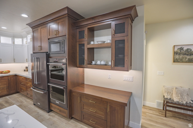 126 North 800 West Mapleton, UT 84664 - Photo 26 of 79 Kitchen featuring glass fronted cabinets, light wood-type flooring, stainless steel appliances, two tone cabinets, and wood counters