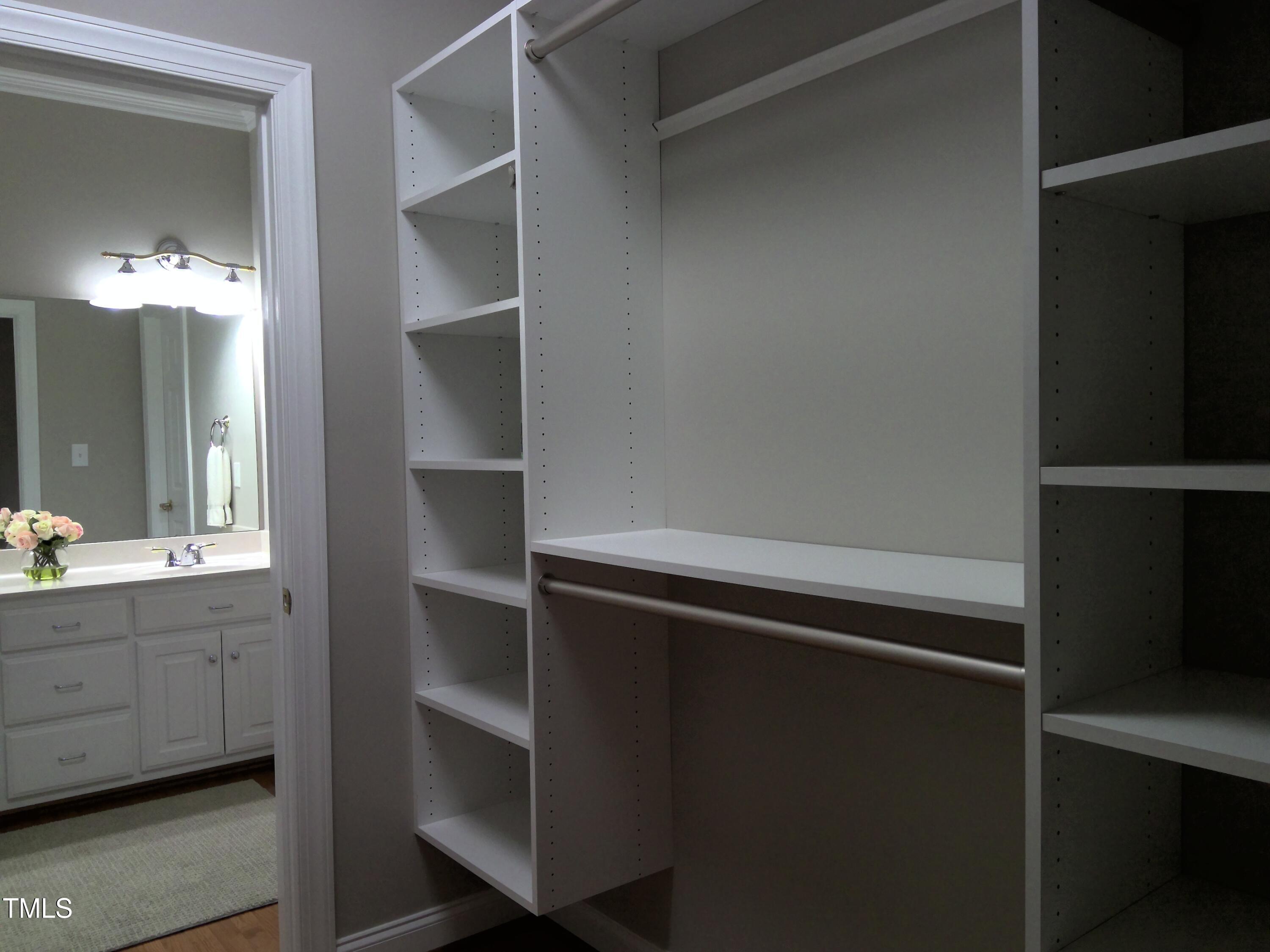 12 Crail Court Durham, NC 27712 - Photo 13 of 29 a room with a closet and wooden floor