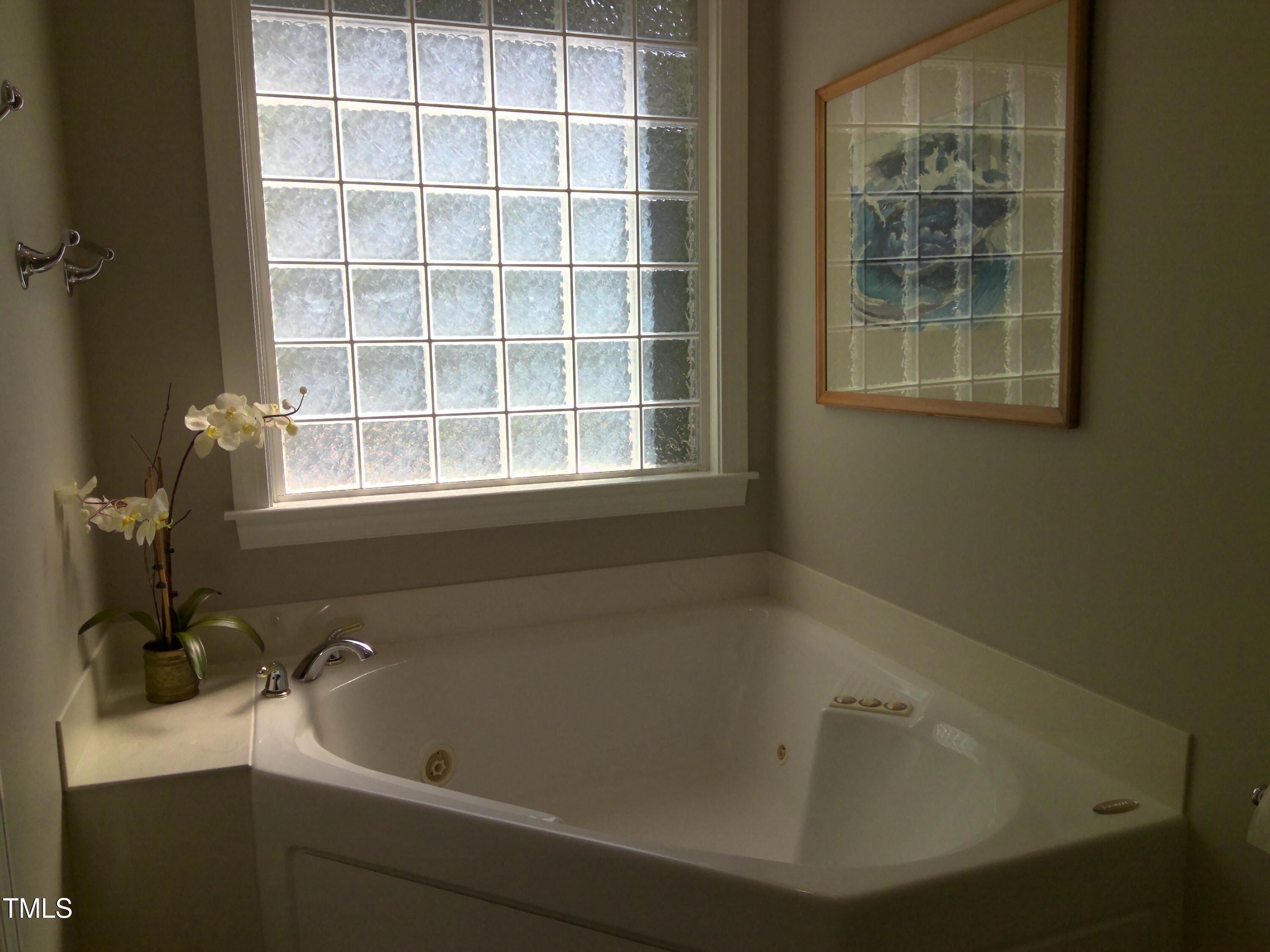 12 Crail Court Durham, NC 27712 - Photo 14 of 29 a bath tub sitting next to a window