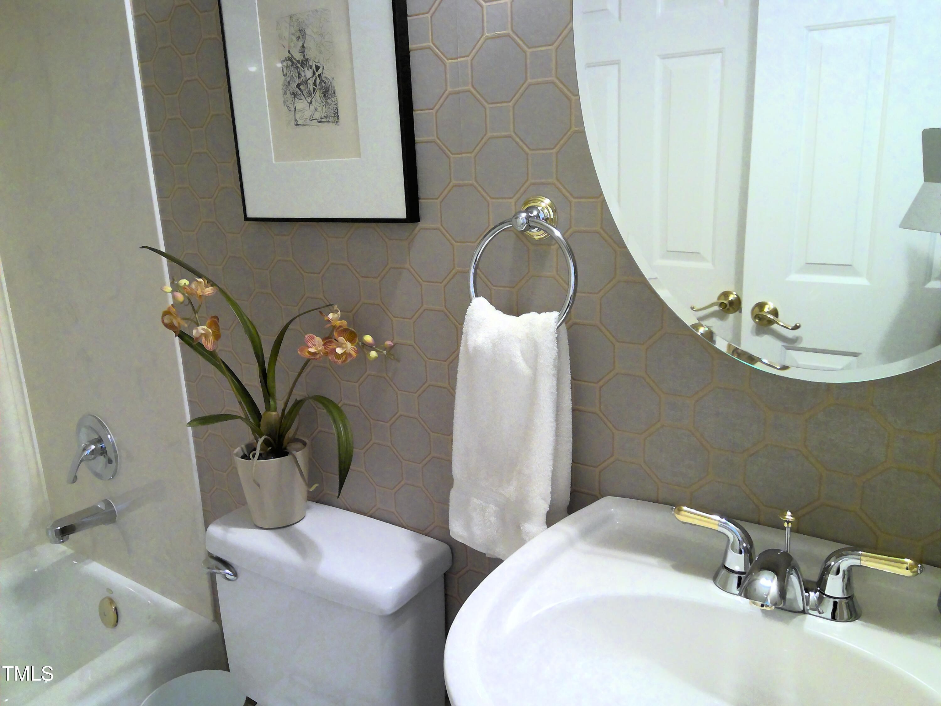 12 Crail Court Durham, NC 27712 - Photo 16 of 29 a bathroom with a sink and a mirror