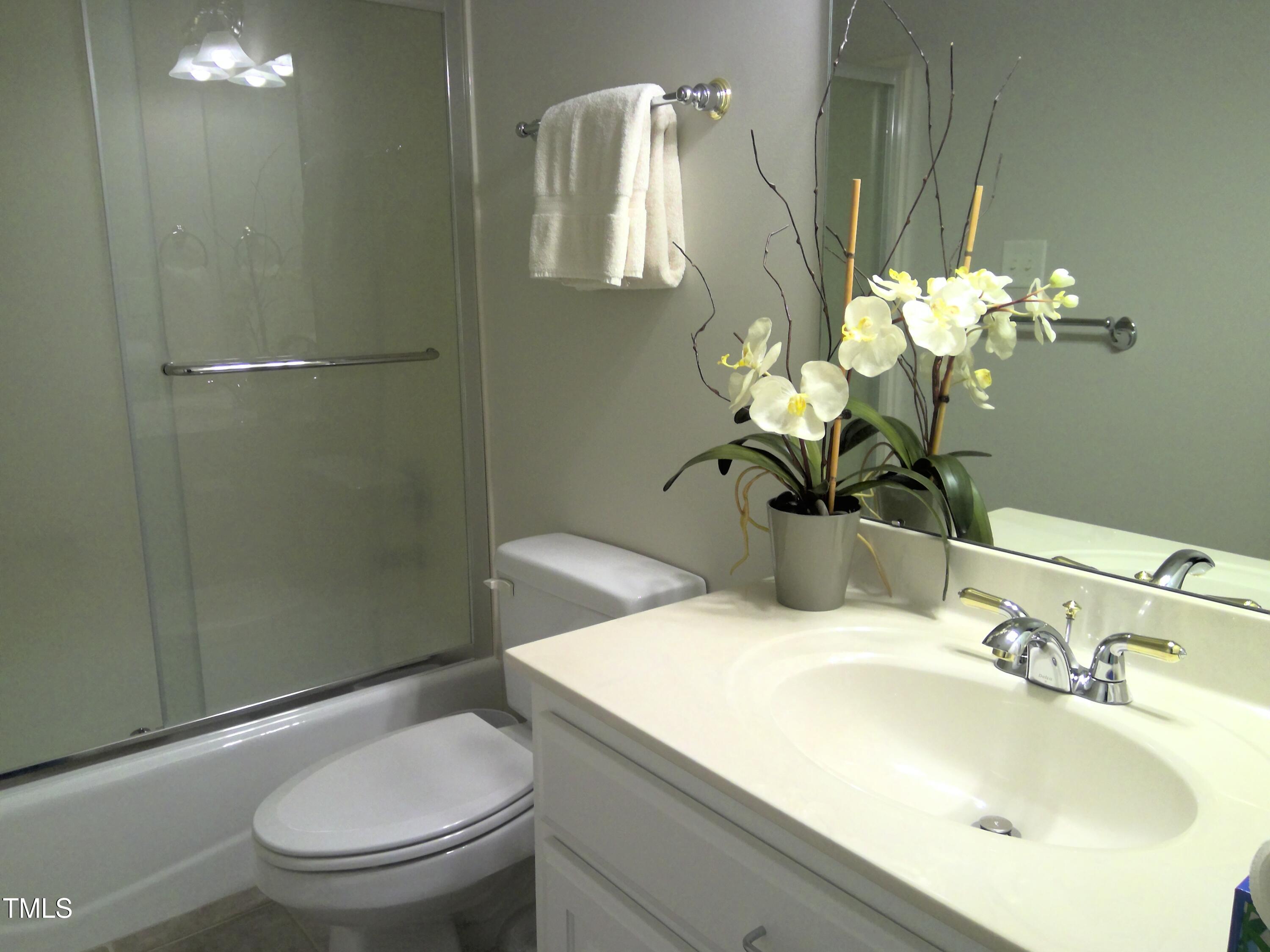 12 Crail Court Durham, NC 27712 - Photo 19 of 29 a bathroom with a sink toilet and shower