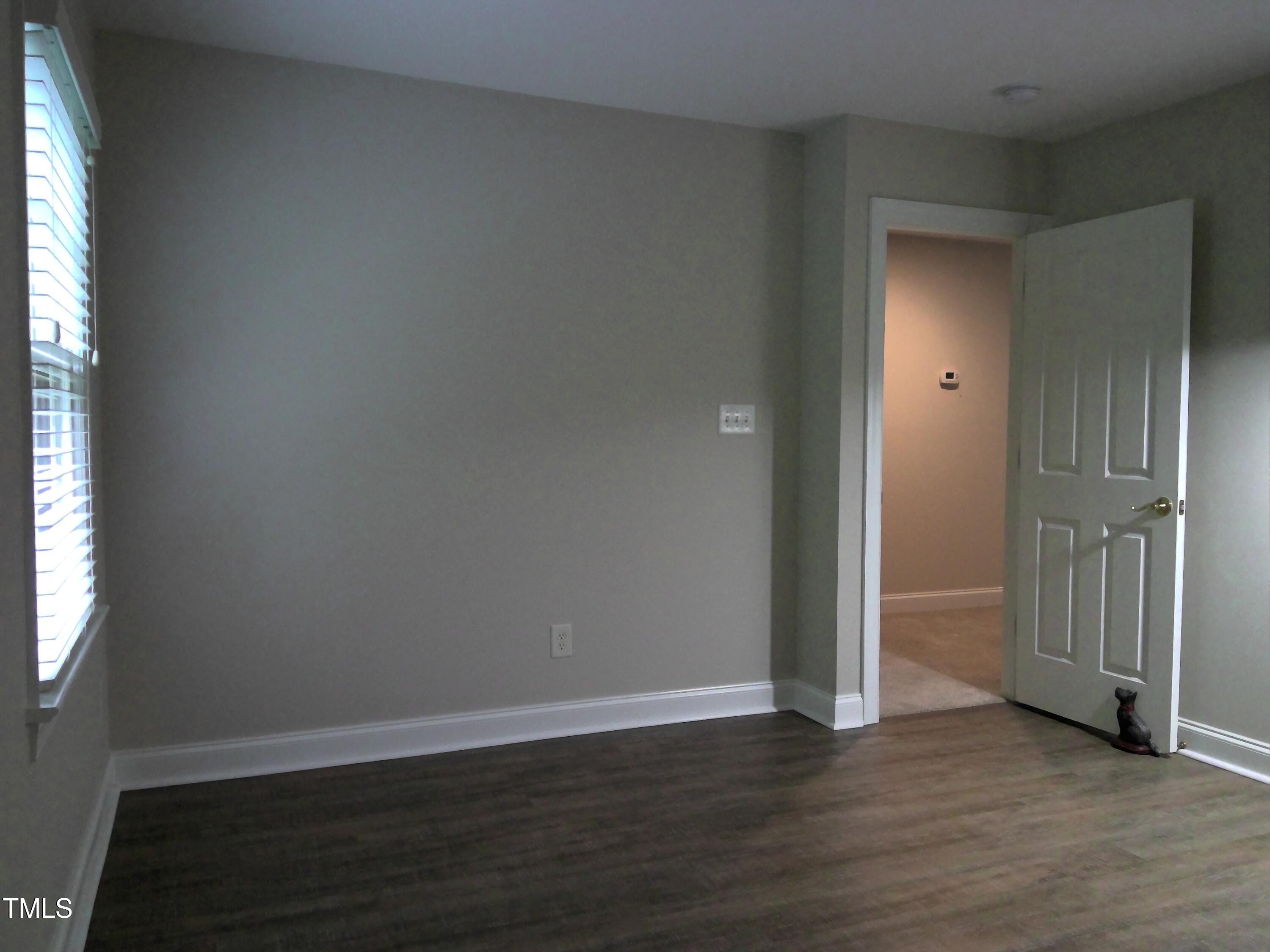 12 Crail Court Durham, NC 27712 - Photo 20 of 29 an empty room with wooden floor and closet