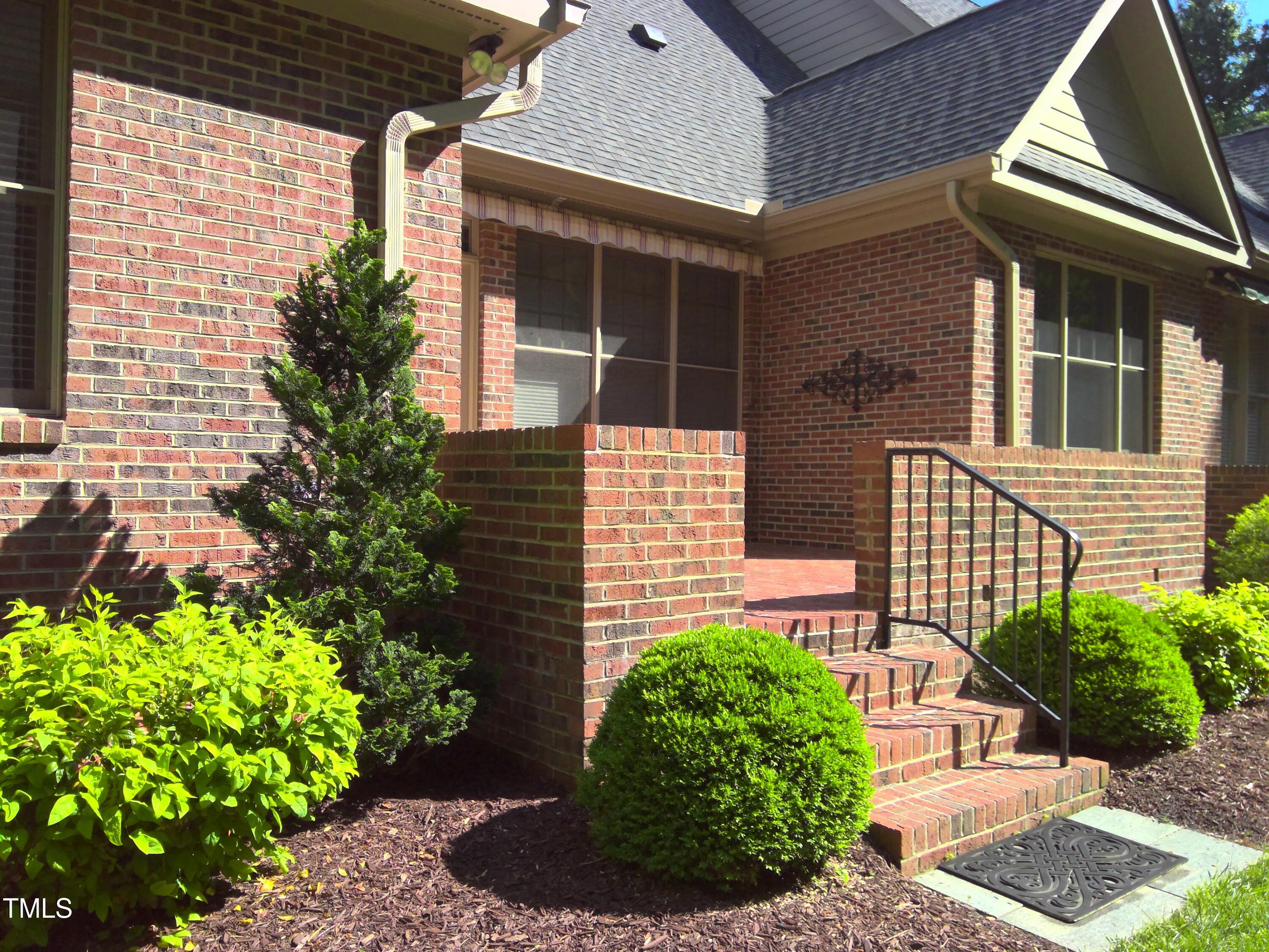 12 Crail Court Durham, NC 27712 - Photo 2 of 29 a front view of a house with garden