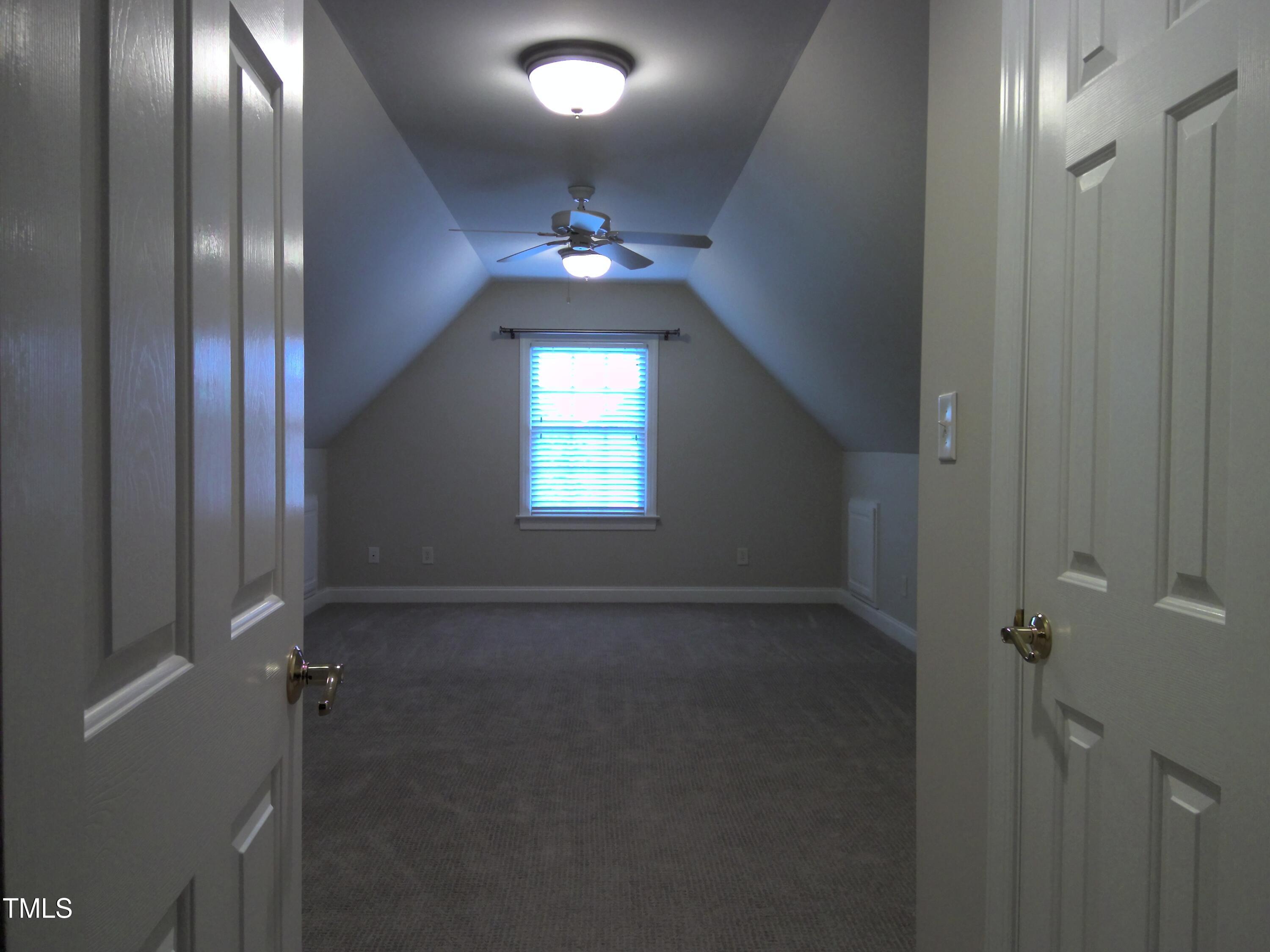 12 Crail Court Durham, NC 27712 - Photo 21 of 29 an empty room with stairs and wooden floor