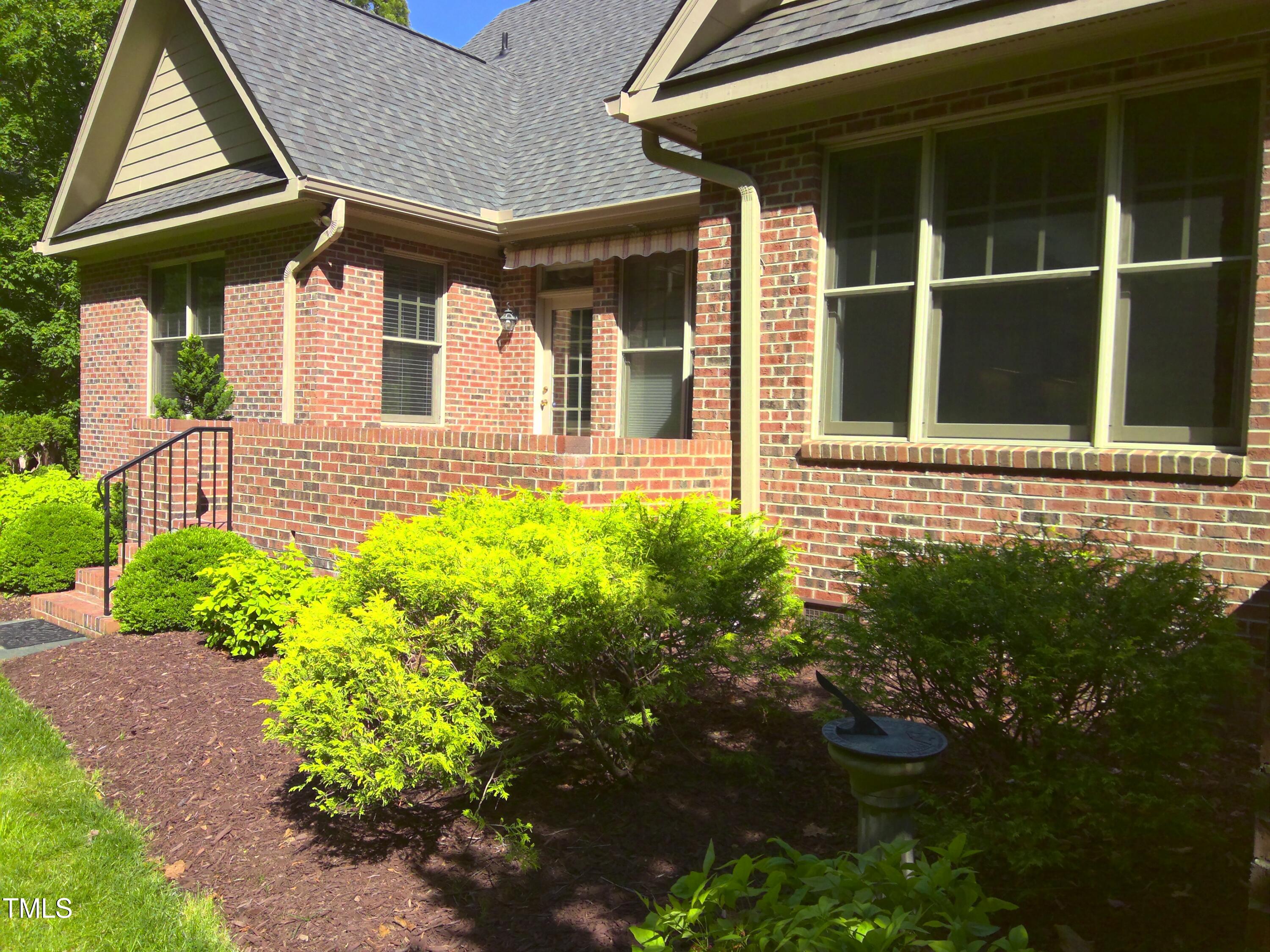 12 Crail Court Durham, NC 27712 - Photo 3 of 29 a front view of a house with garden
