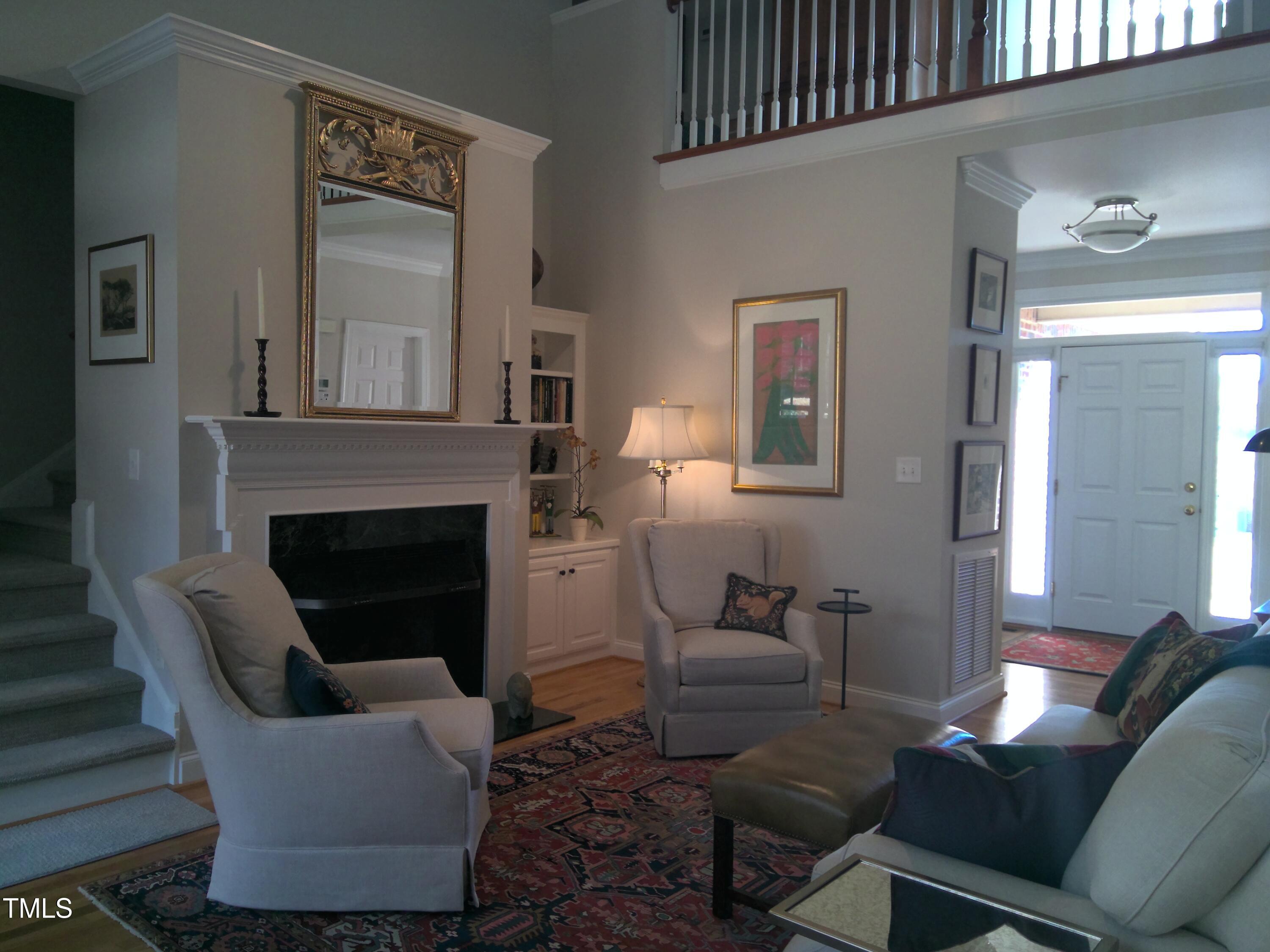 12 Crail Court Durham, NC 27712 - Photo 4 of 29 a living room with furniture and a fireplace