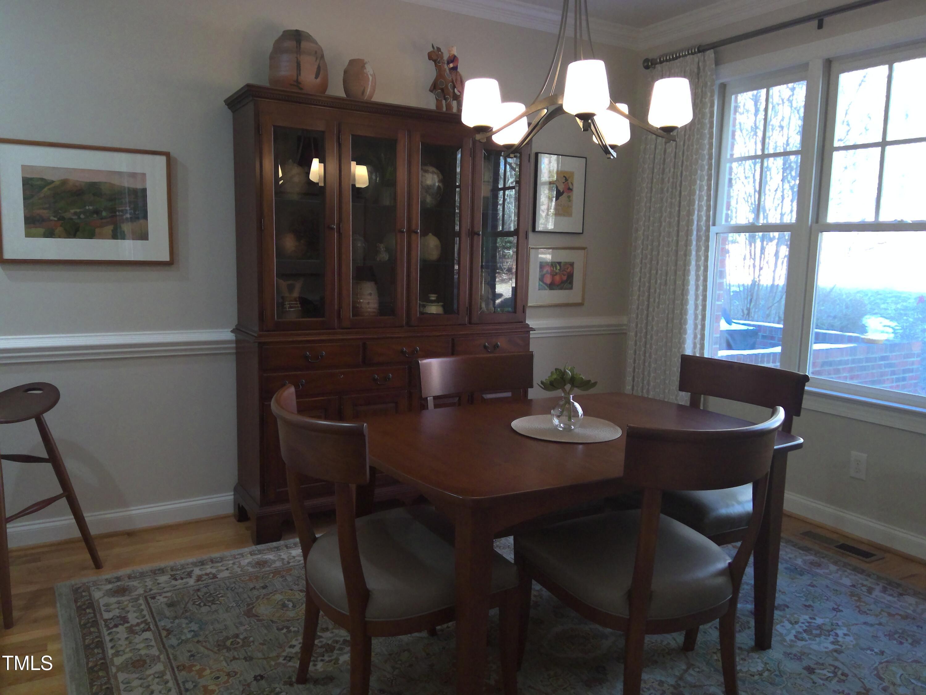 12 Crail Court Durham, NC 27712 - Photo 7 of 29 a view of a dining room with furniture and chandelier