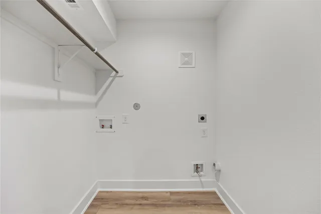 a kitchen with granite countertop a sink stainless steel appliances and white cabinets