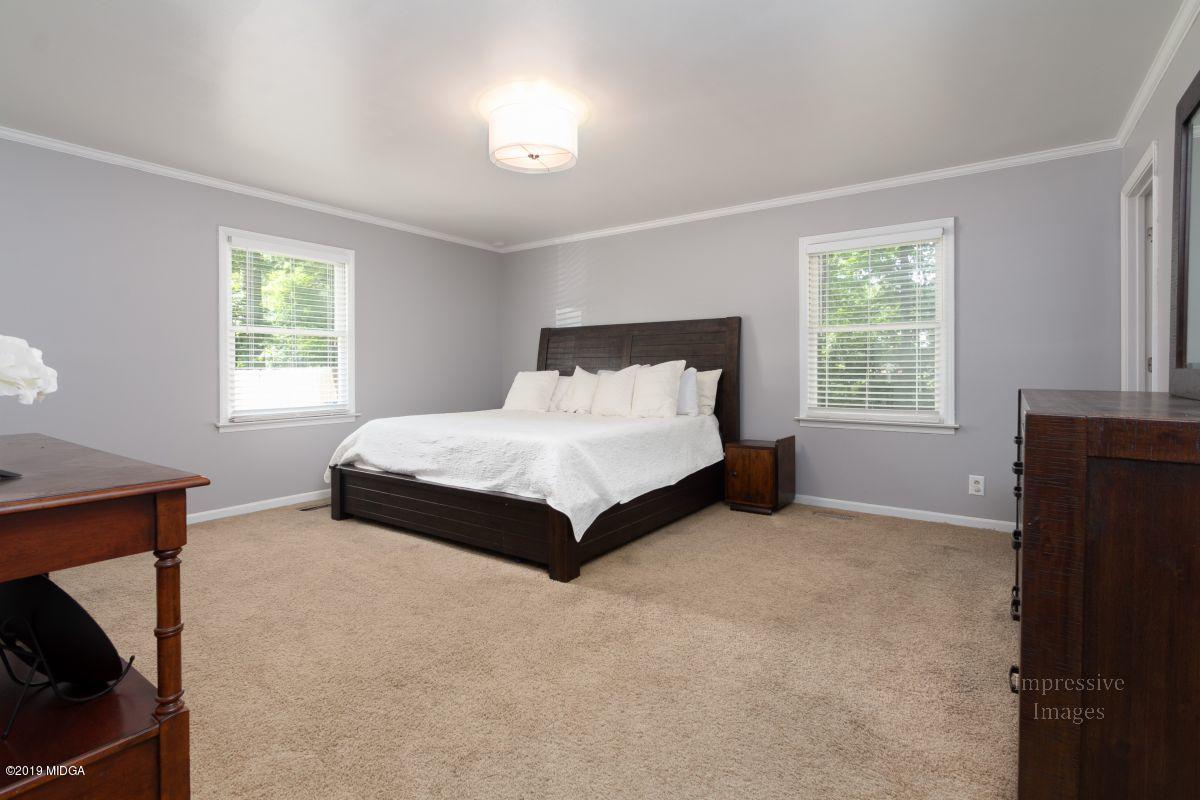 180 Castlegate Road Macon, GA 31210 - Photo 12 of 23 a bedroom with a bed and window
